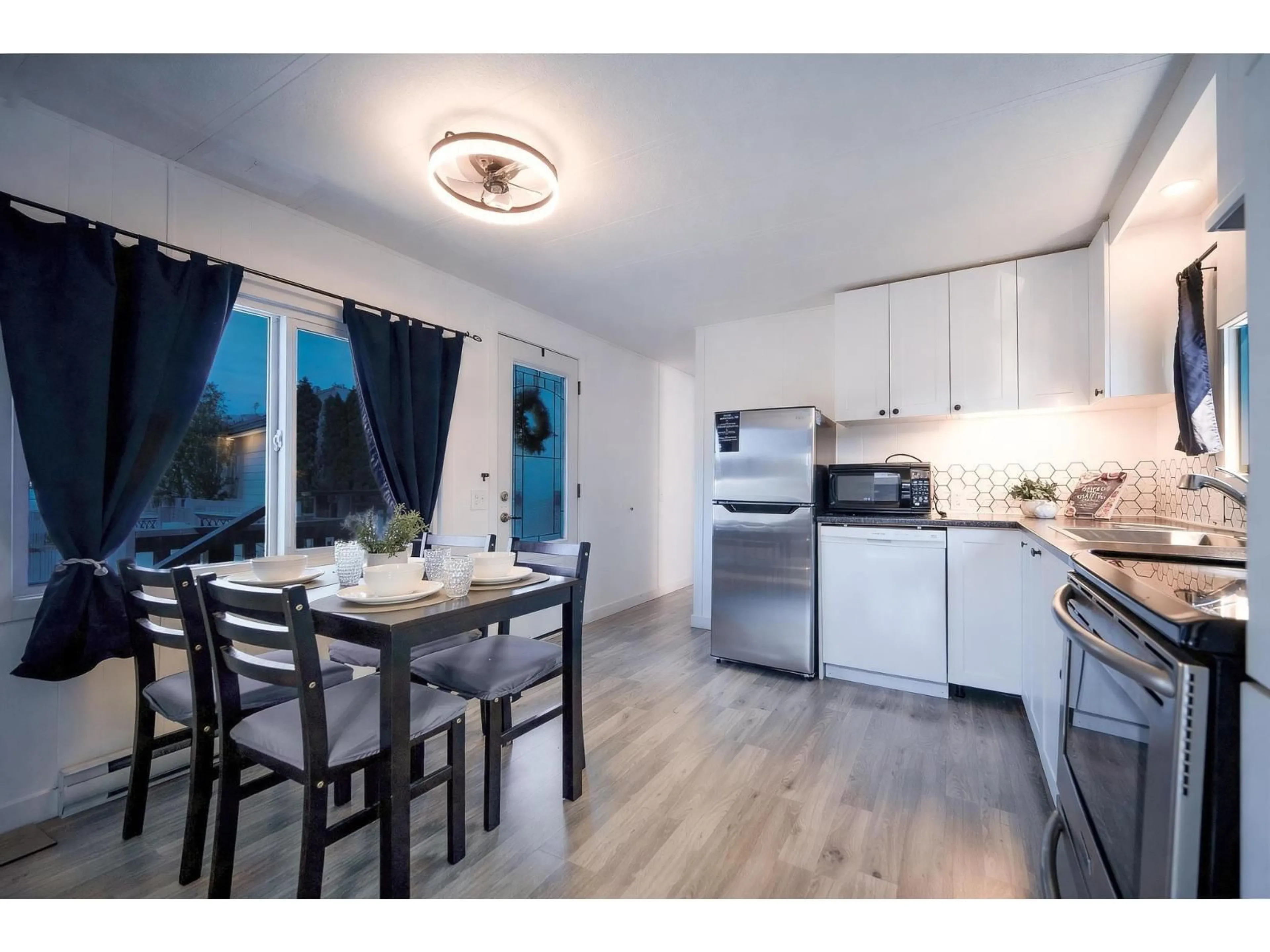 Open concept kitchen, wood/laminate floor for 25 - 26892 FRASER HIGHWAY, Langley British Columbia V4W3V3