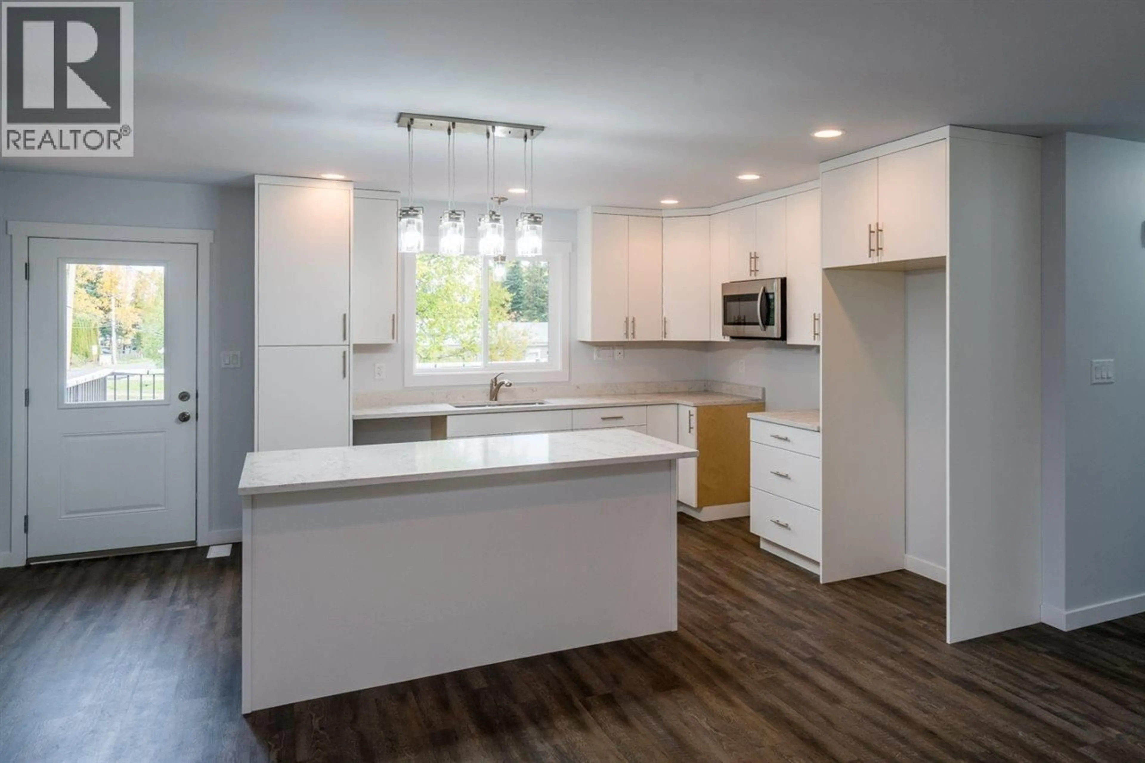 Open concept kitchen, wood/laminate floor for 8191 SABYAM ROAD, Prince George British Columbia V2K2K4