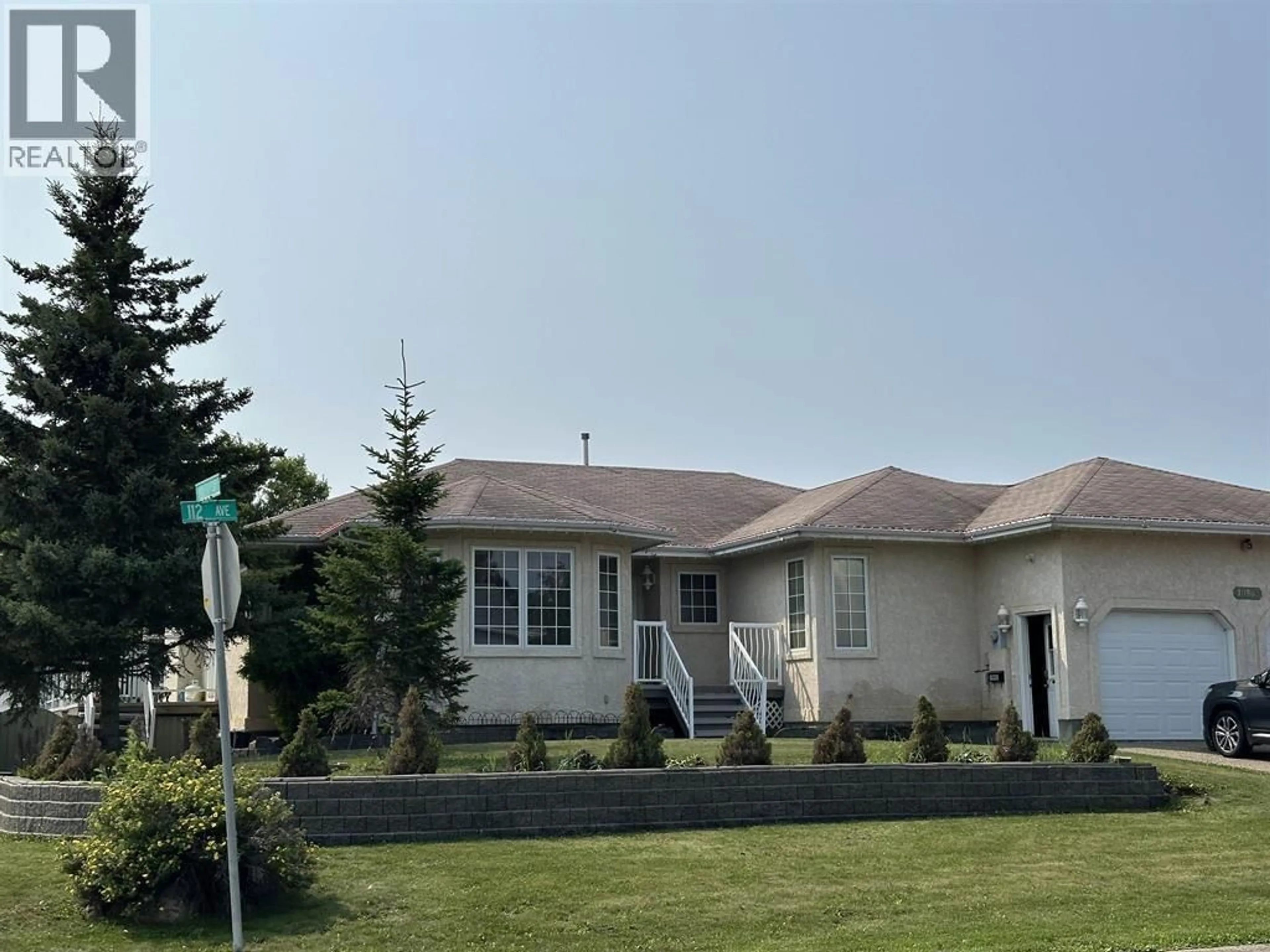 Home with vinyl exterior material, street for 10903 112 AVENUE, Fort St. John British Columbia V1J6R7