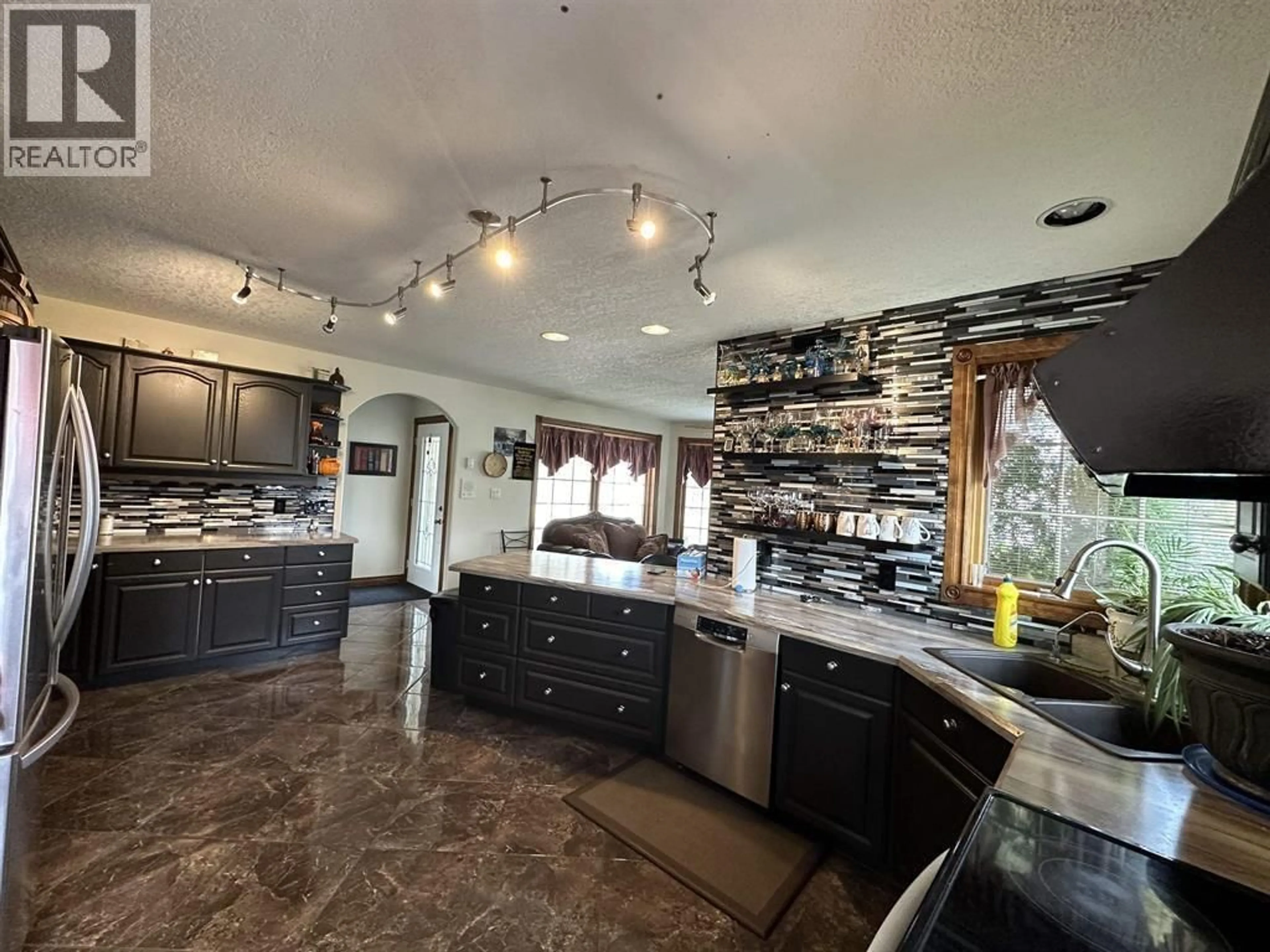 Open concept kitchen, ceramic/tile floor for 10903 112 AVENUE, Fort St. John British Columbia V1J6R7