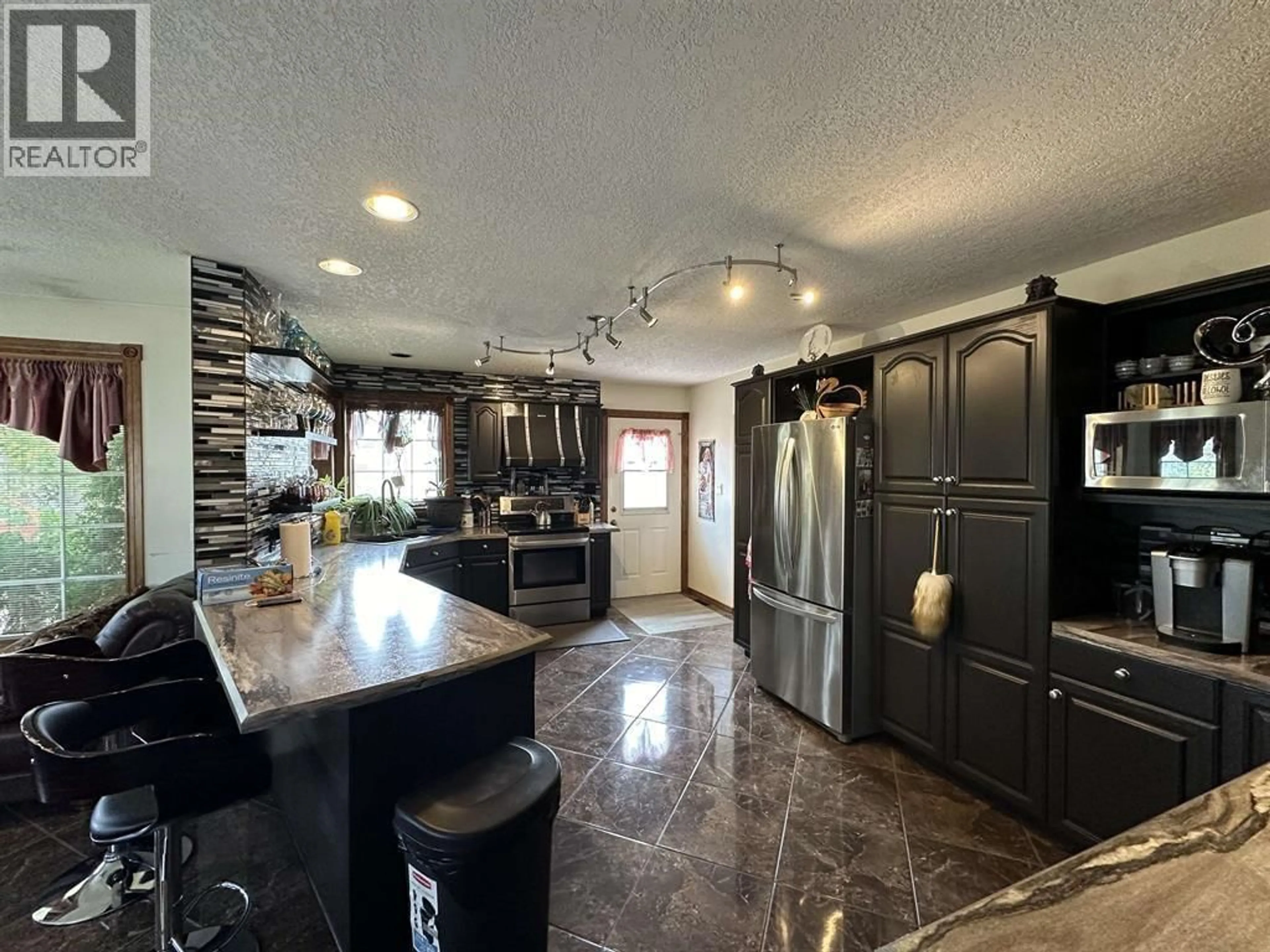 Open concept kitchen, ceramic/tile floor for 10903 112 AVENUE, Fort St. John British Columbia V1J6R7
