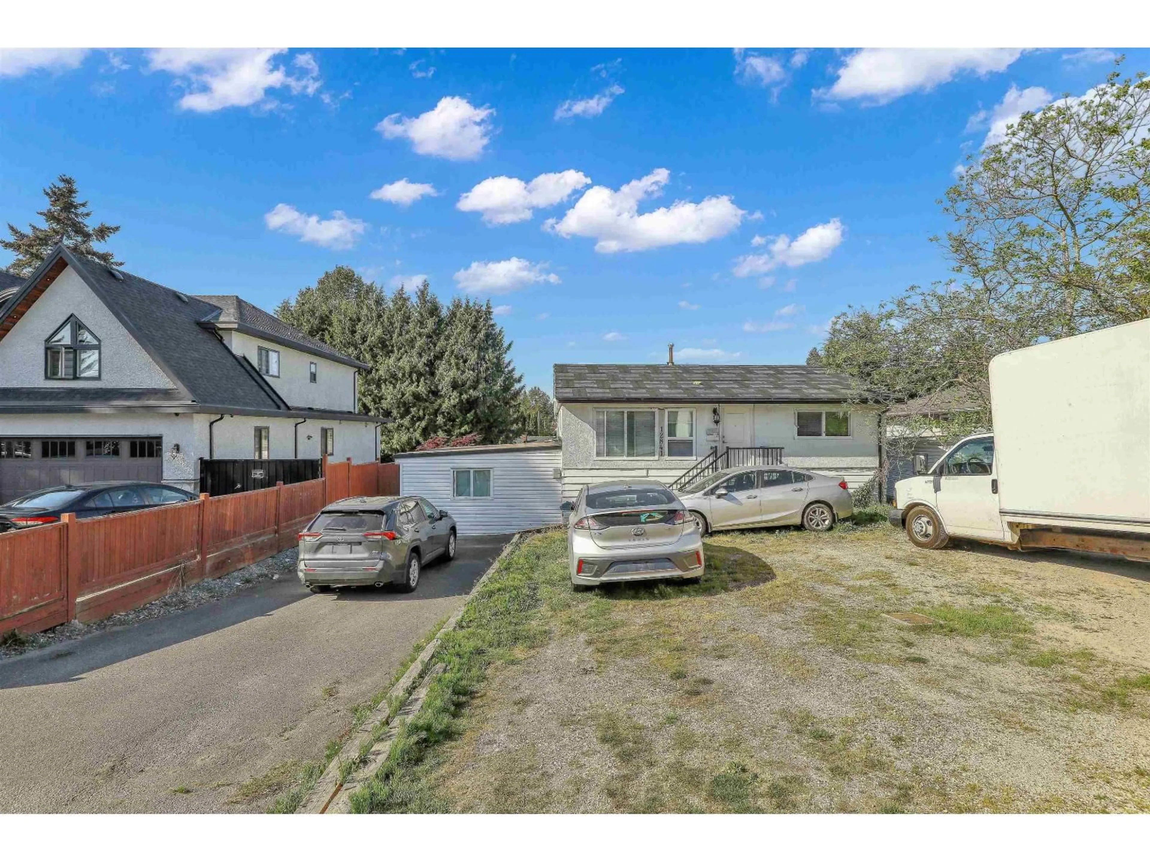 A pic from outside/outdoor area/front of a property/back of a property/a pic from drone, street for 12841 98 AVENUE, Surrey British Columbia V3T1B1