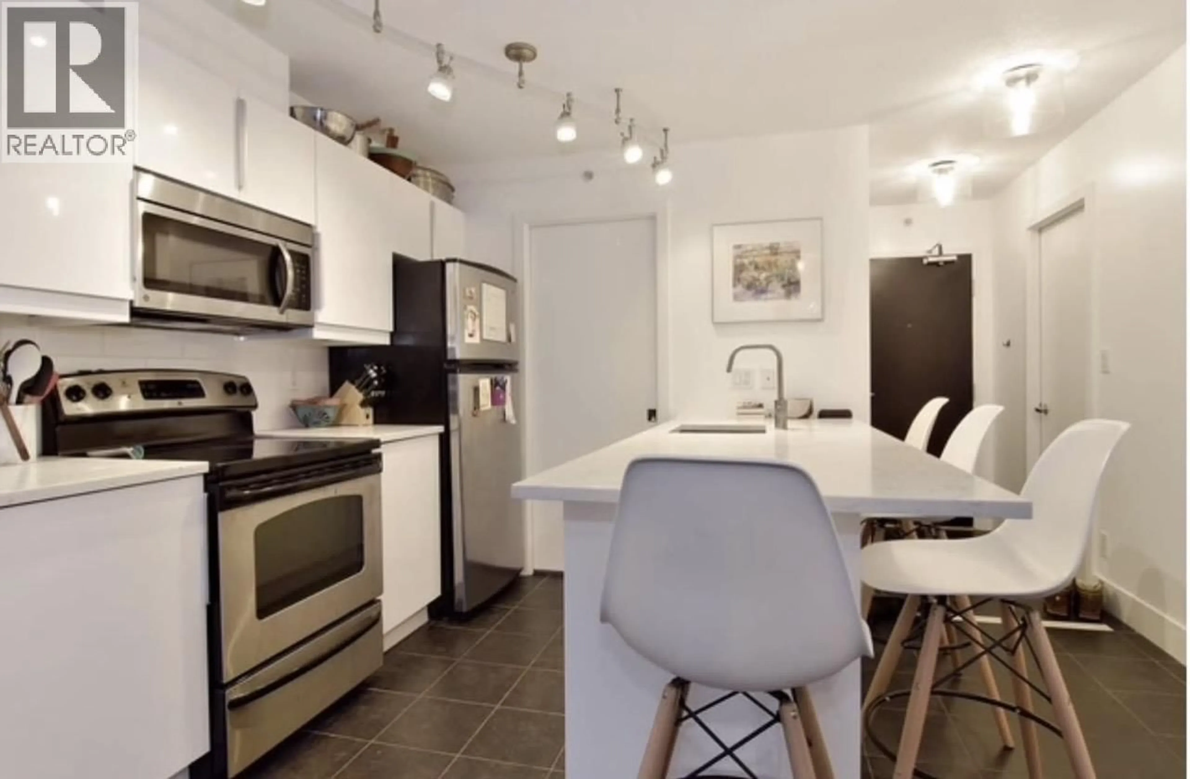 Open concept kitchen, ceramic/tile floor for 409 - 933 HORNBY STREET, Vancouver British Columbia V6Z3G4