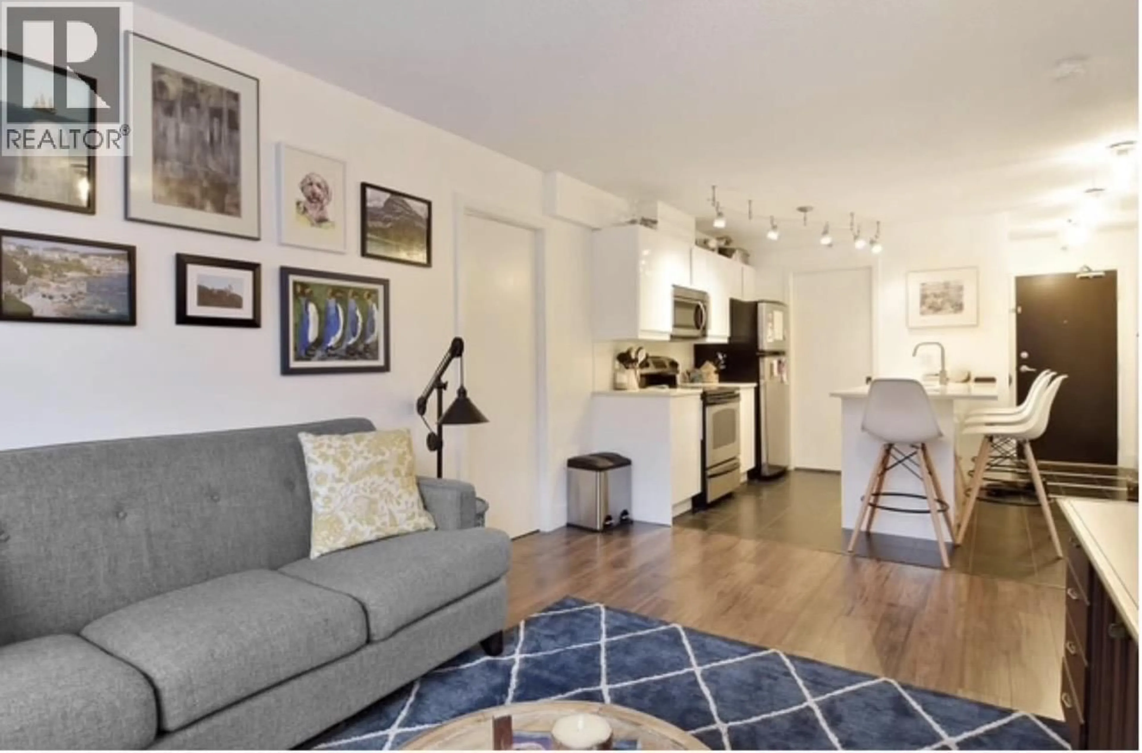Living room with furniture, wood/laminate floor for 409 - 933 HORNBY STREET, Vancouver British Columbia V6Z3G4