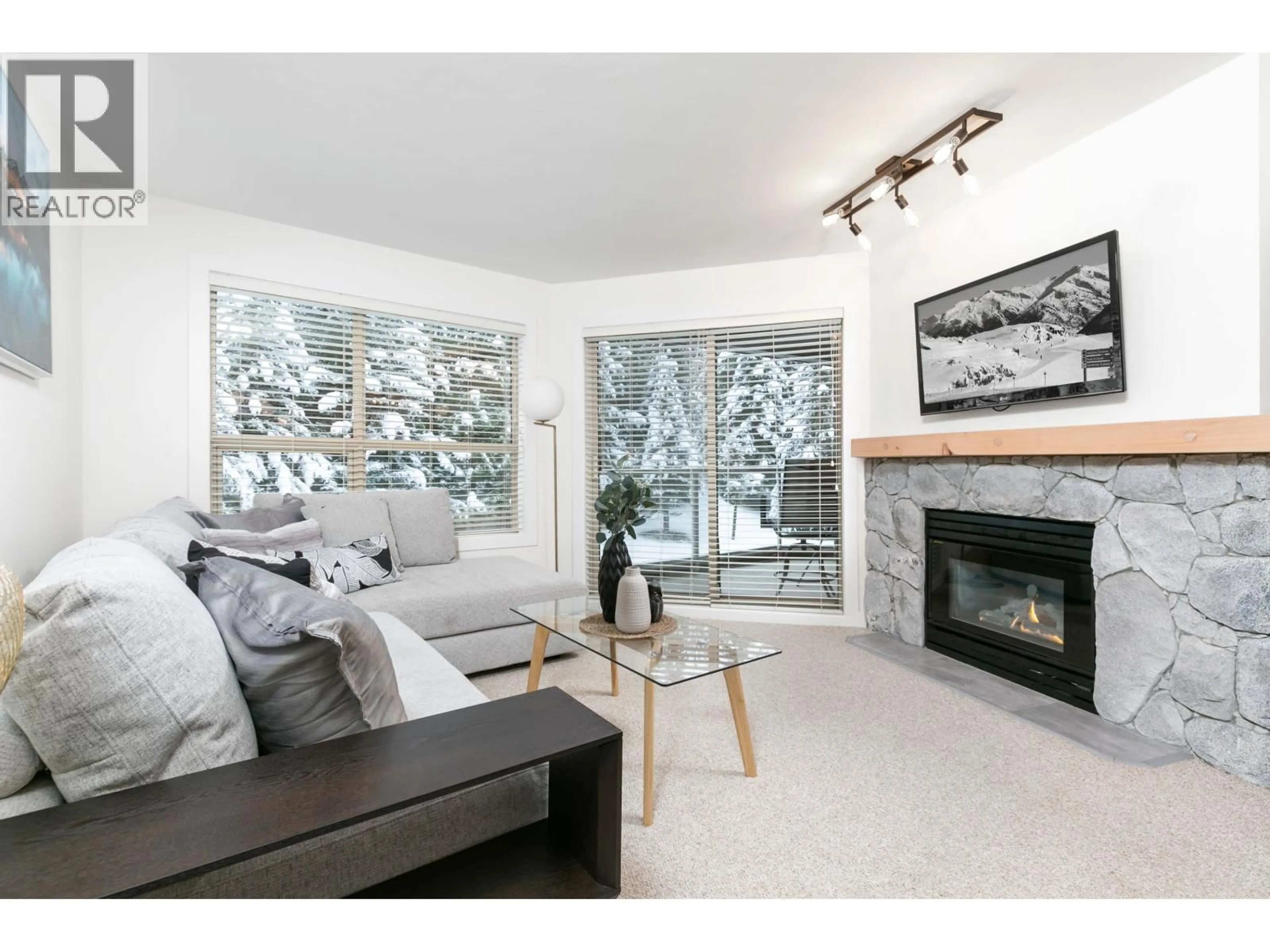 Living room with furniture, wood/laminate floor for 347 - 4800 SPEARHEAD DRIVE, Whistler British Columbia V8E1G1