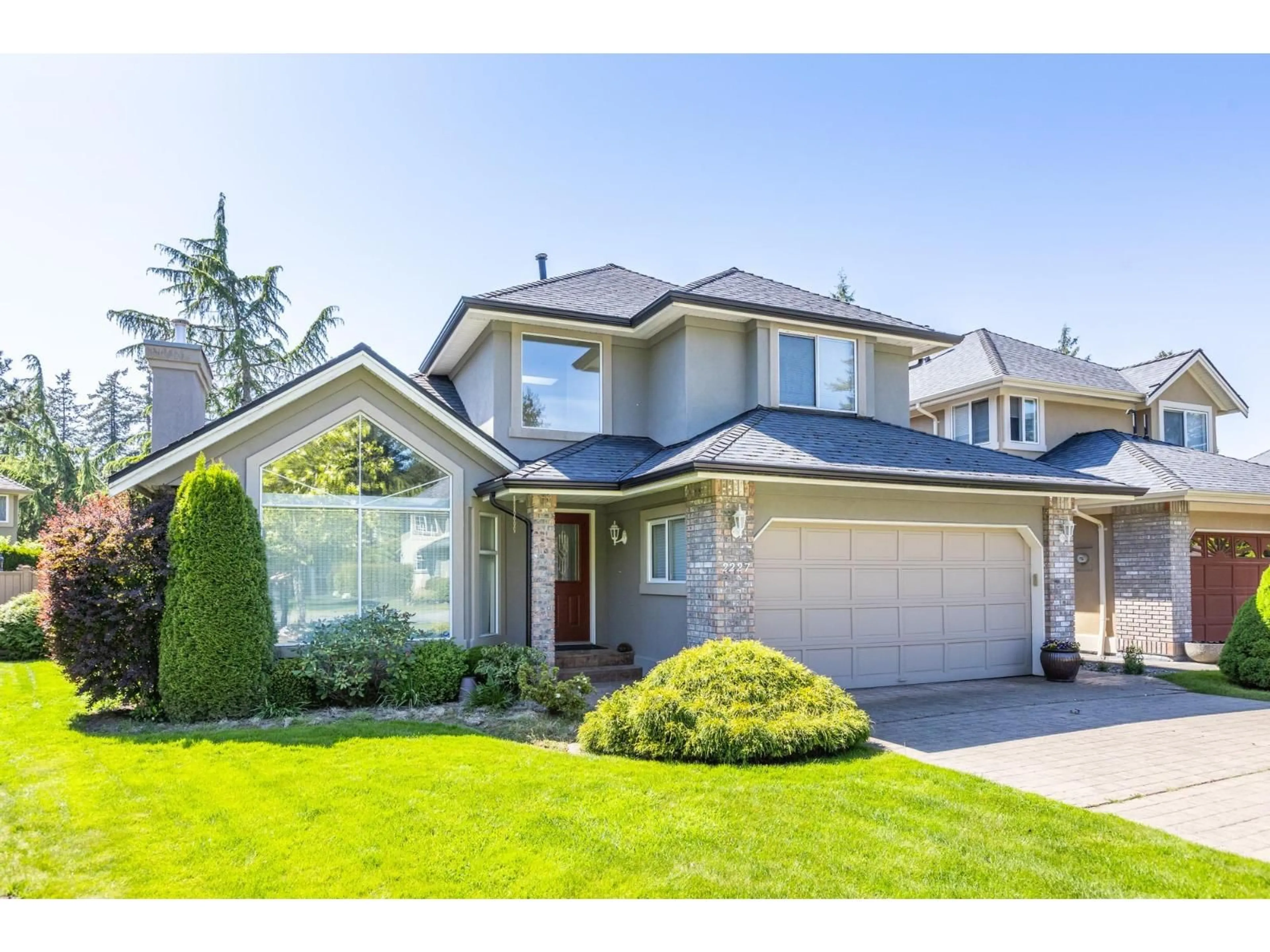 Home with vinyl exterior material, street for 2227 140A STREET, Surrey British Columbia V4A9R8