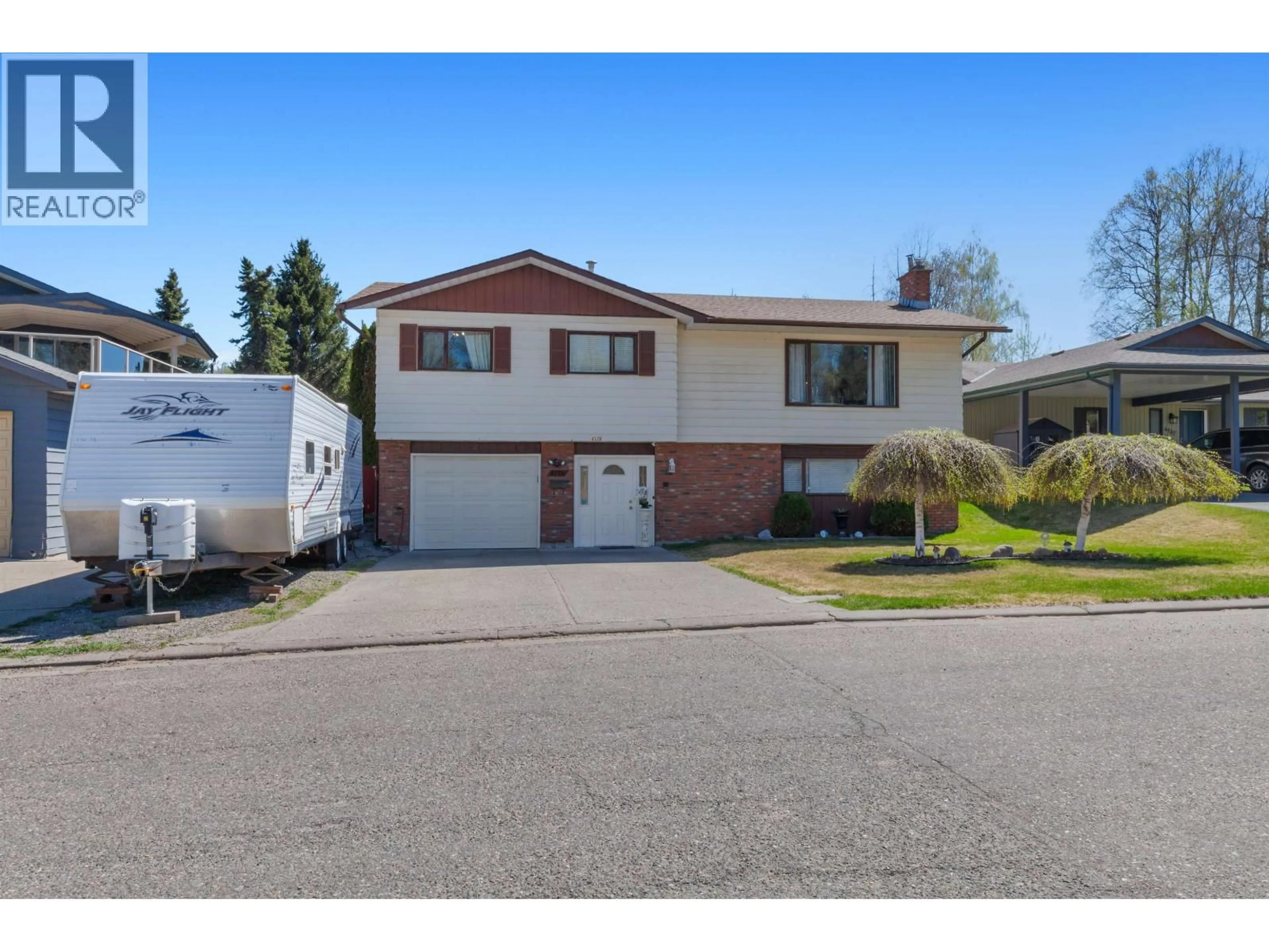 Home with vinyl exterior material, street for 4126 BAKER ROAD, Prince George British Columbia V2N5K6