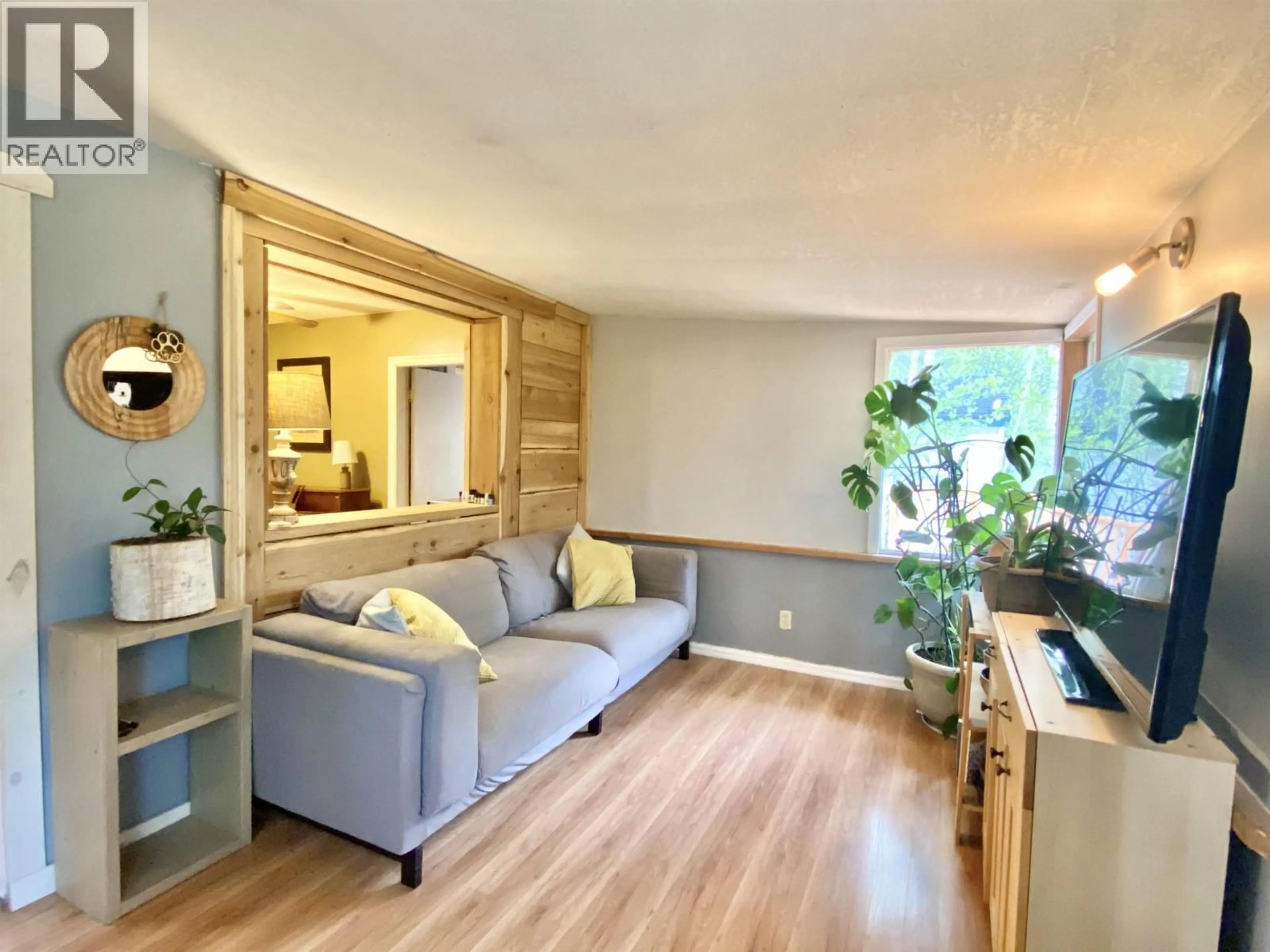 Living room with furniture, wood/laminate floor for 1010 MAIN STREET, Valemount British Columbia V0E2Z0