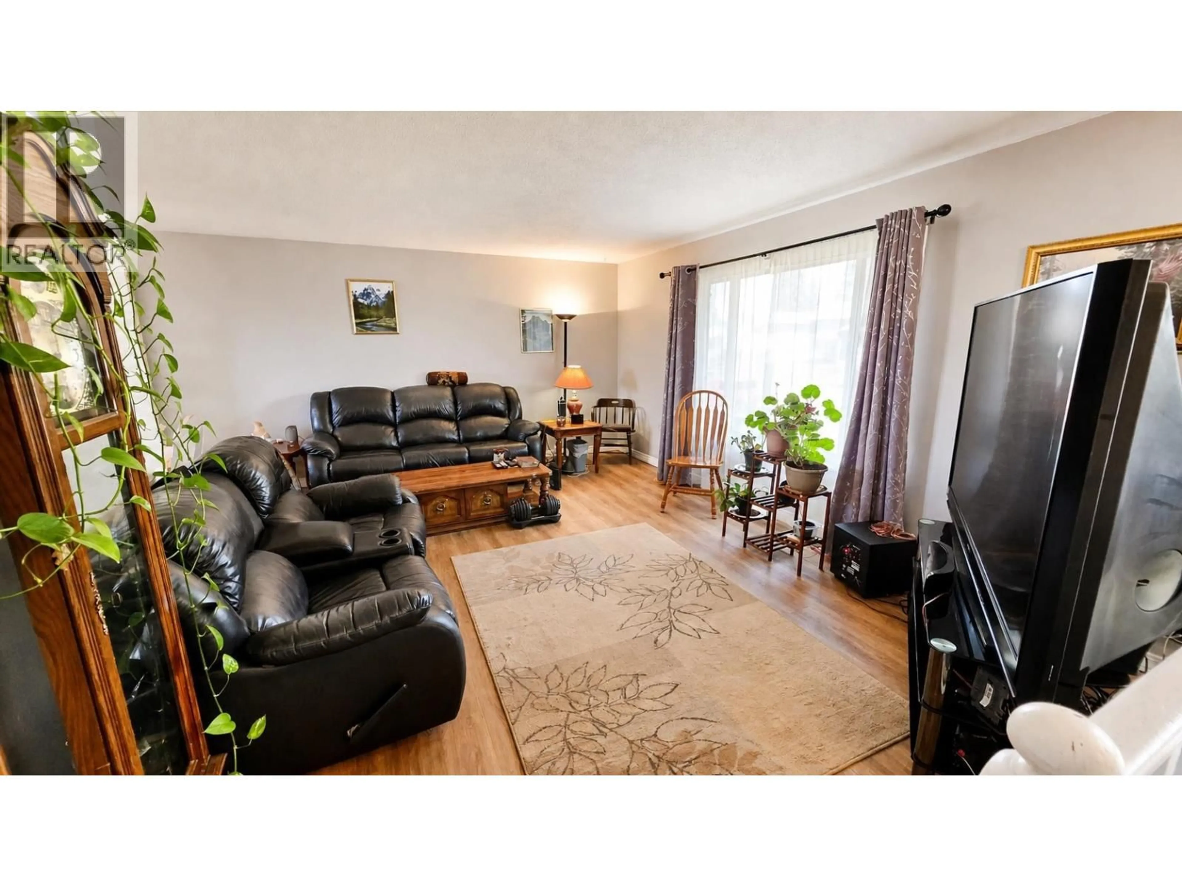 Living room with furniture, wood/laminate floor for 1965 SULLIVAN WAY, Houston British Columbia V0J1Z0