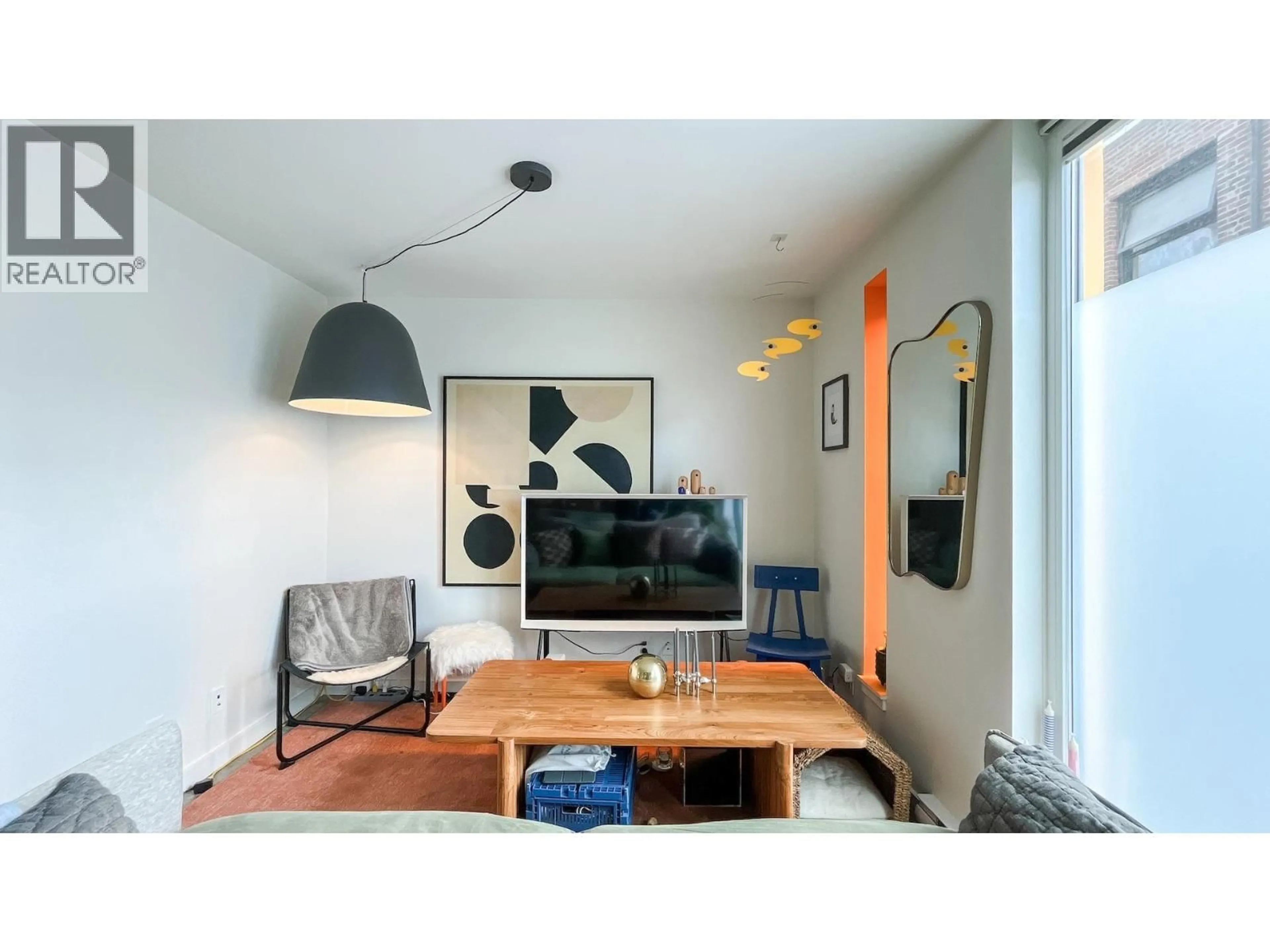 Living room with furniture, wood/laminate floor for 310 - 150 CORDOVA STREET, Vancouver British Columbia V6A0E7
