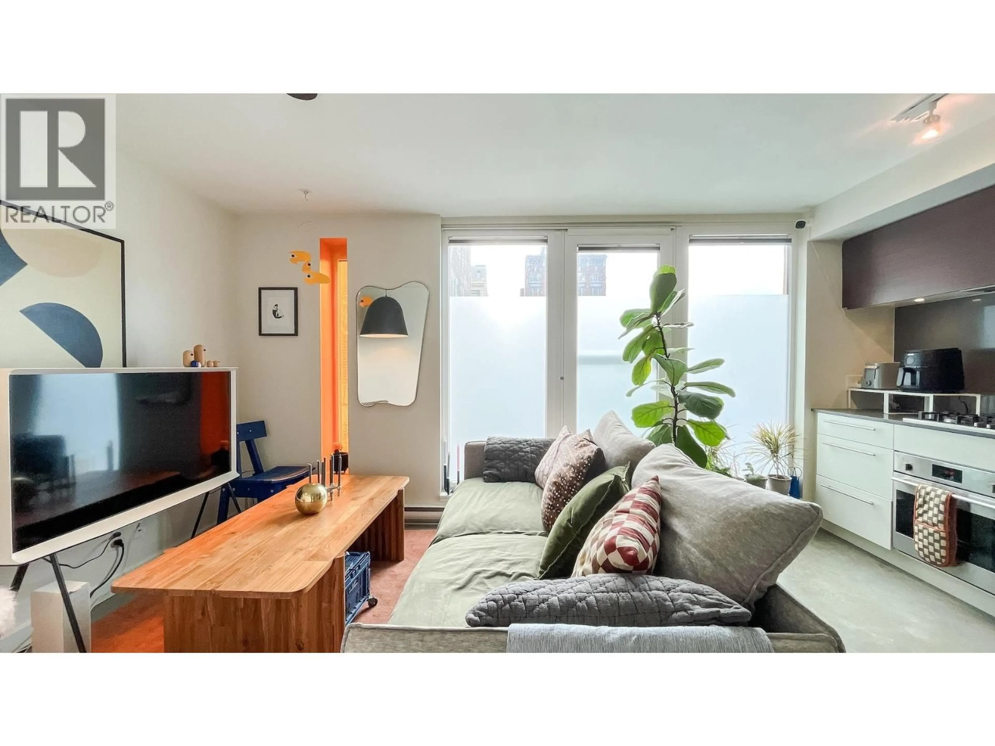 Living room with furniture, wood/laminate floor for 310 - 150 CORDOVA STREET, Vancouver British Columbia V6A0E7