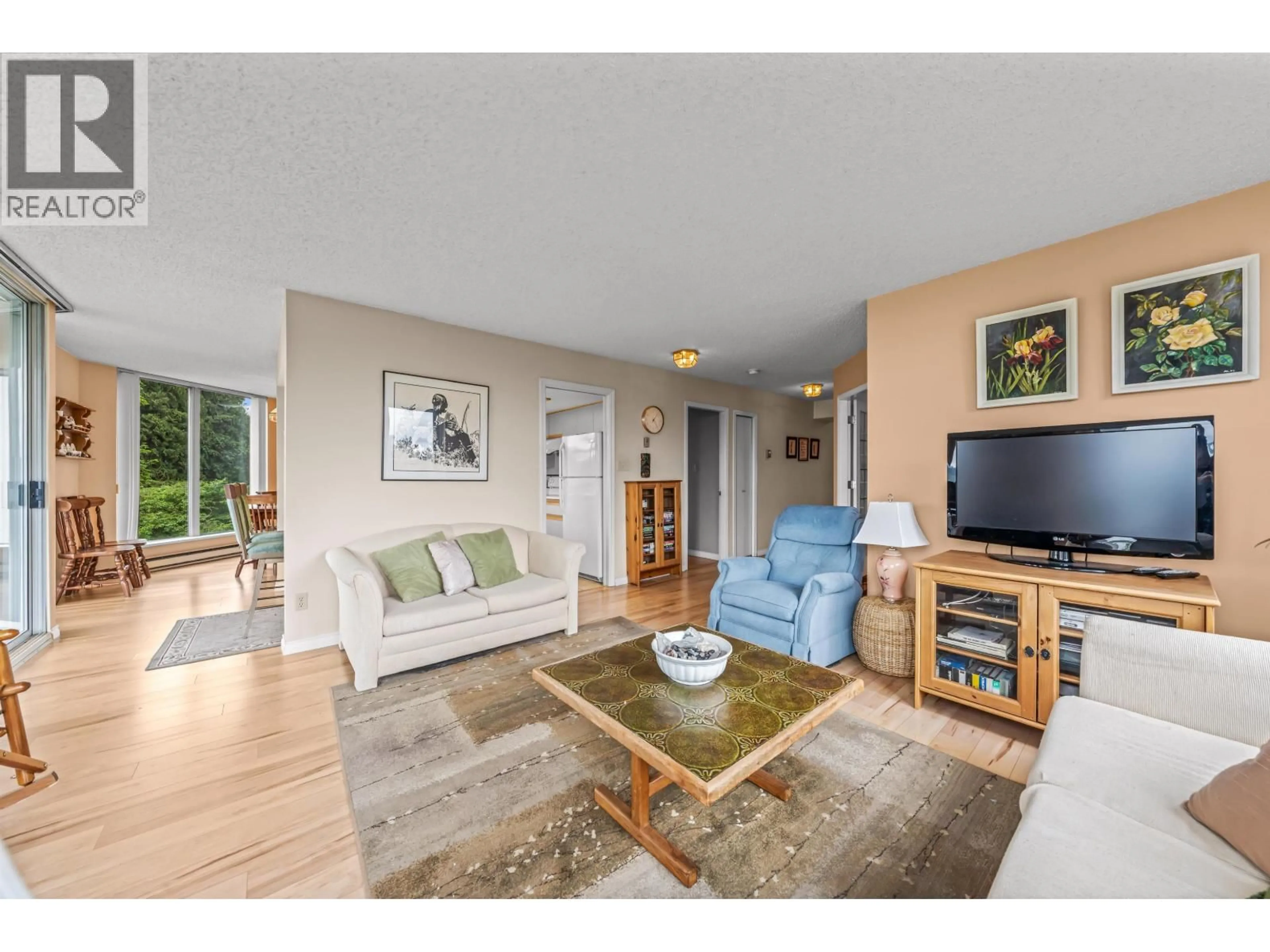 Living room with furniture, wood/laminate floor for 305 - 69 JAMIESON COURT, New Westminster British Columbia V3L5R3