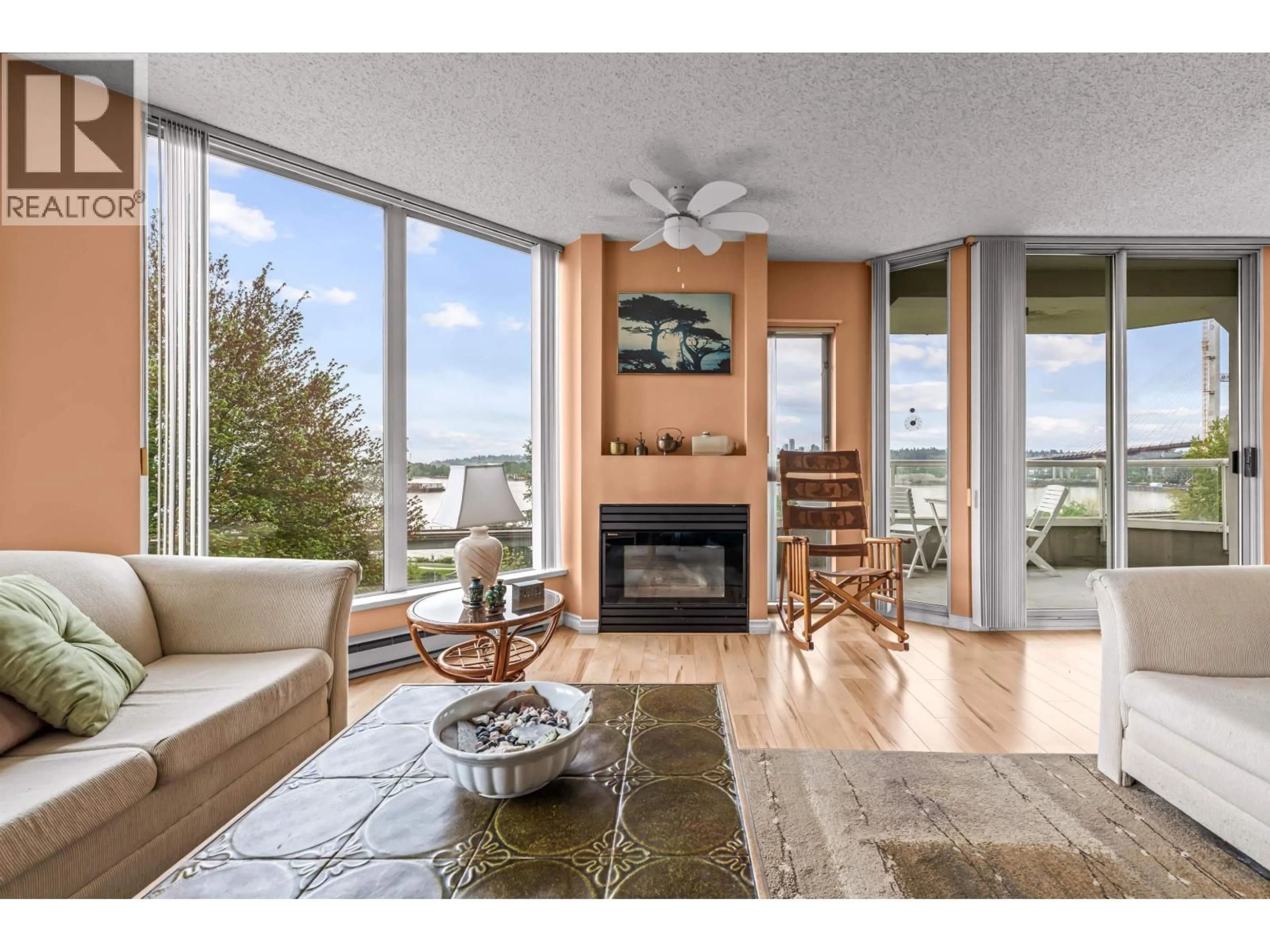 Living room with furniture, wood/laminate floor for 305 - 69 JAMIESON COURT, New Westminster British Columbia V3L5R3