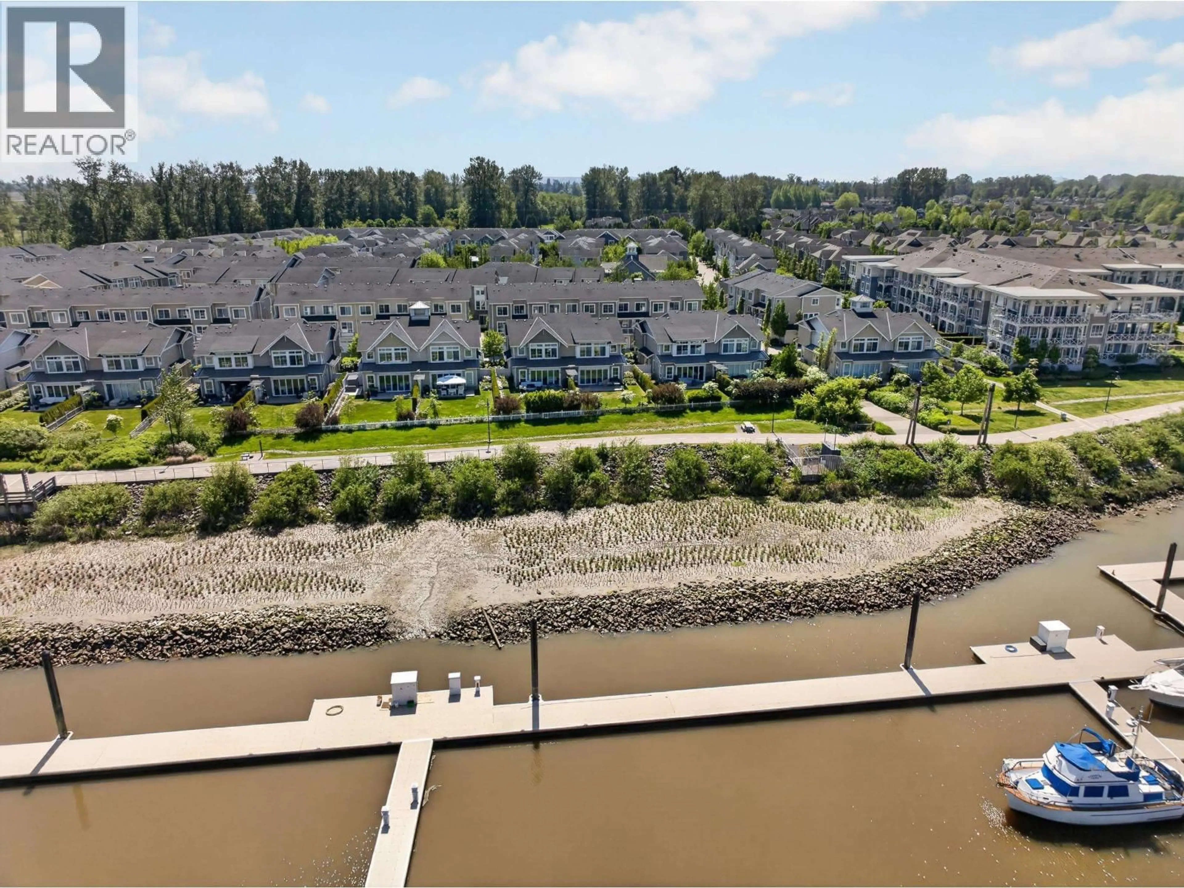A pic from outside/outdoor area/front of a property/back of a property/a pic from drone, water/lake/river/ocean view for 63 - 5551 ADMIRAL WAY, Delta British Columbia V4K0C9