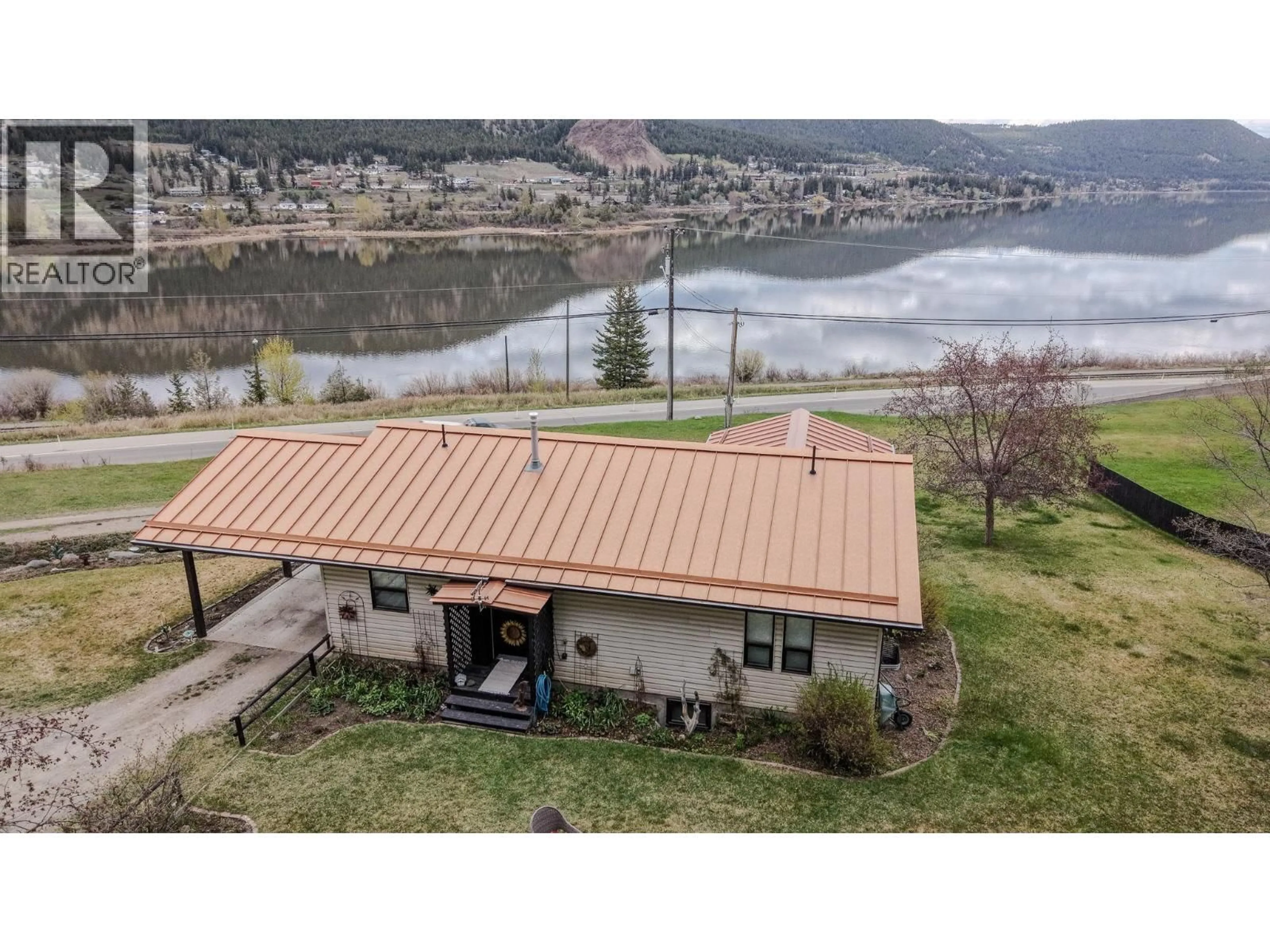 A pic from outside/outdoor area/front of a property/back of a property/a pic from drone, water/lake/river/ocean view for 1273 SOUTH LAKESIDE DRIVE, Williams Lake British Columbia V2G3A7