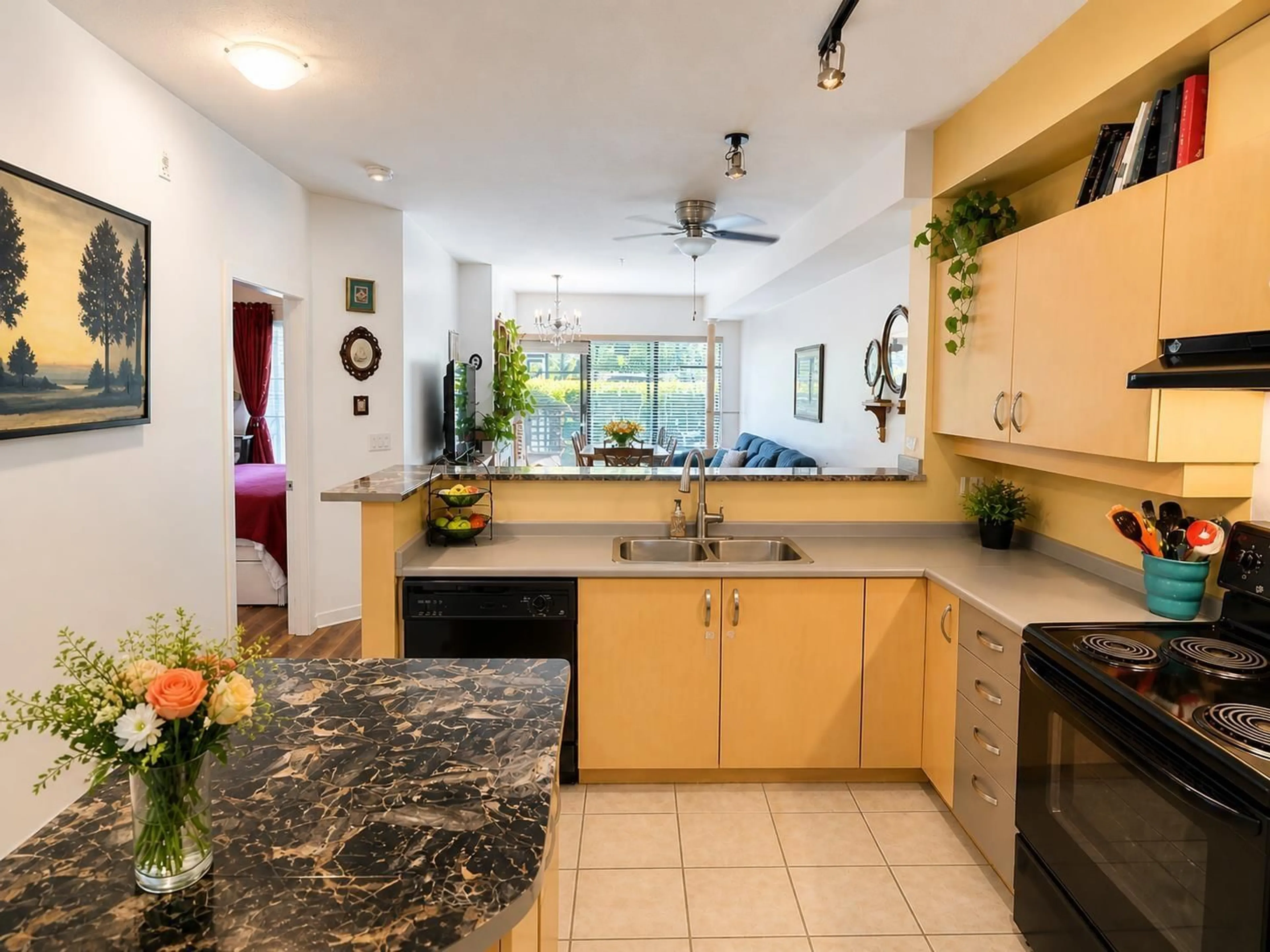 Open concept kitchen, ceramic/tile floor for 121 - 10866 CITY PARKWAY, Surrey British Columbia V3T5W9