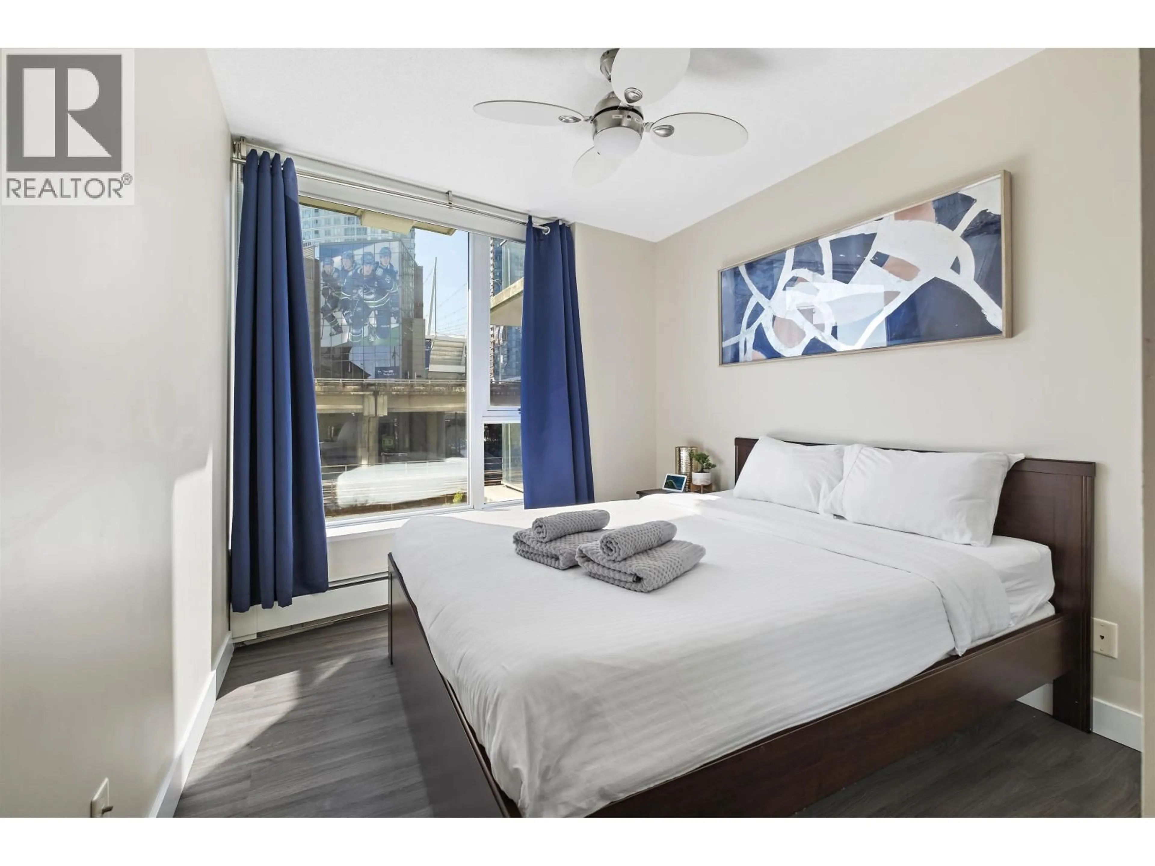 Bedroom with bed, wood/laminate floor for 305 - 689 ABBOTT STREET, Vancouver British Columbia V6J0J2
