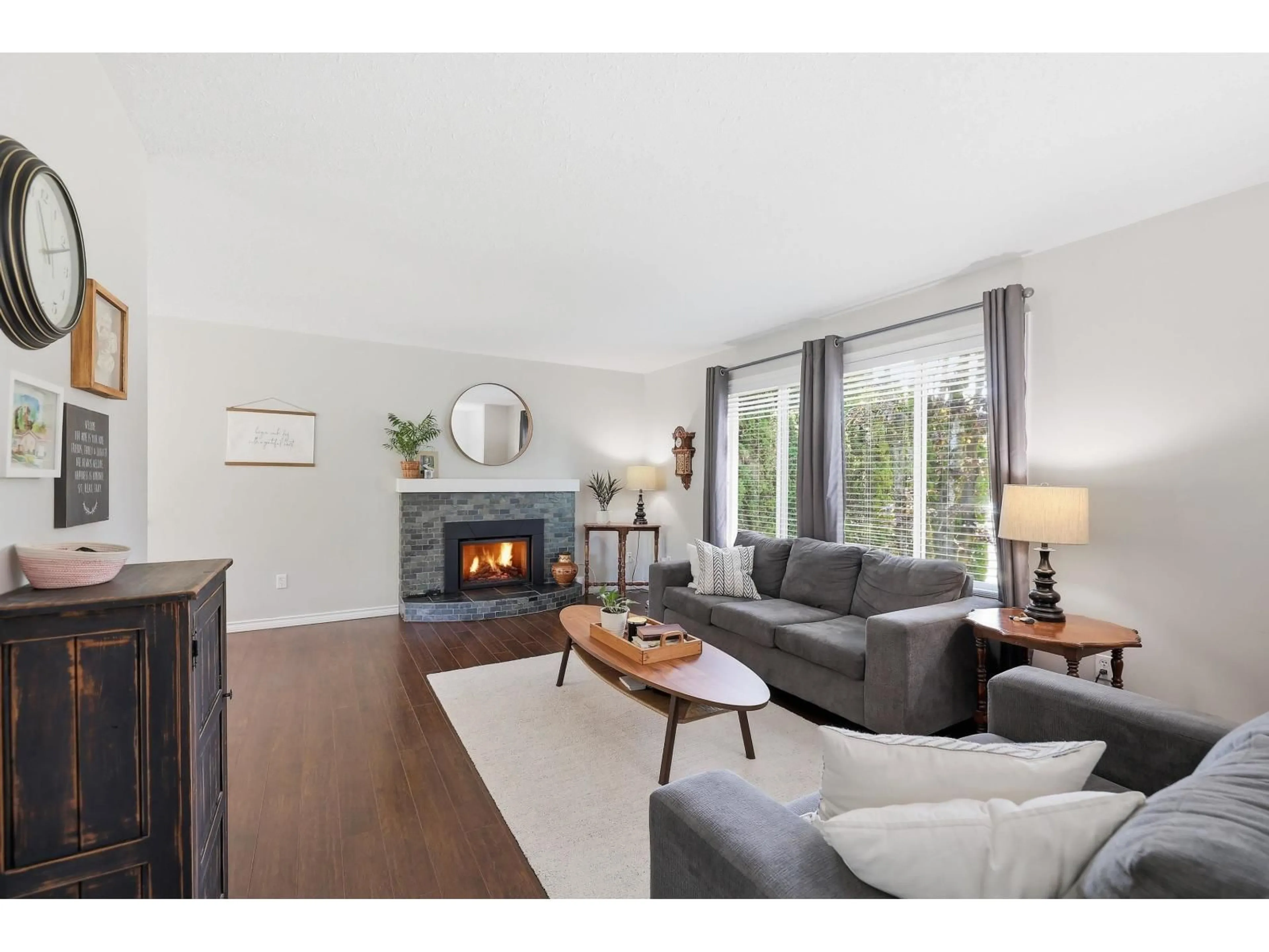 Living room with furniture, wood/laminate floor for 34661 ELLIOT AVENUE, Abbotsford British Columbia V2S5L6