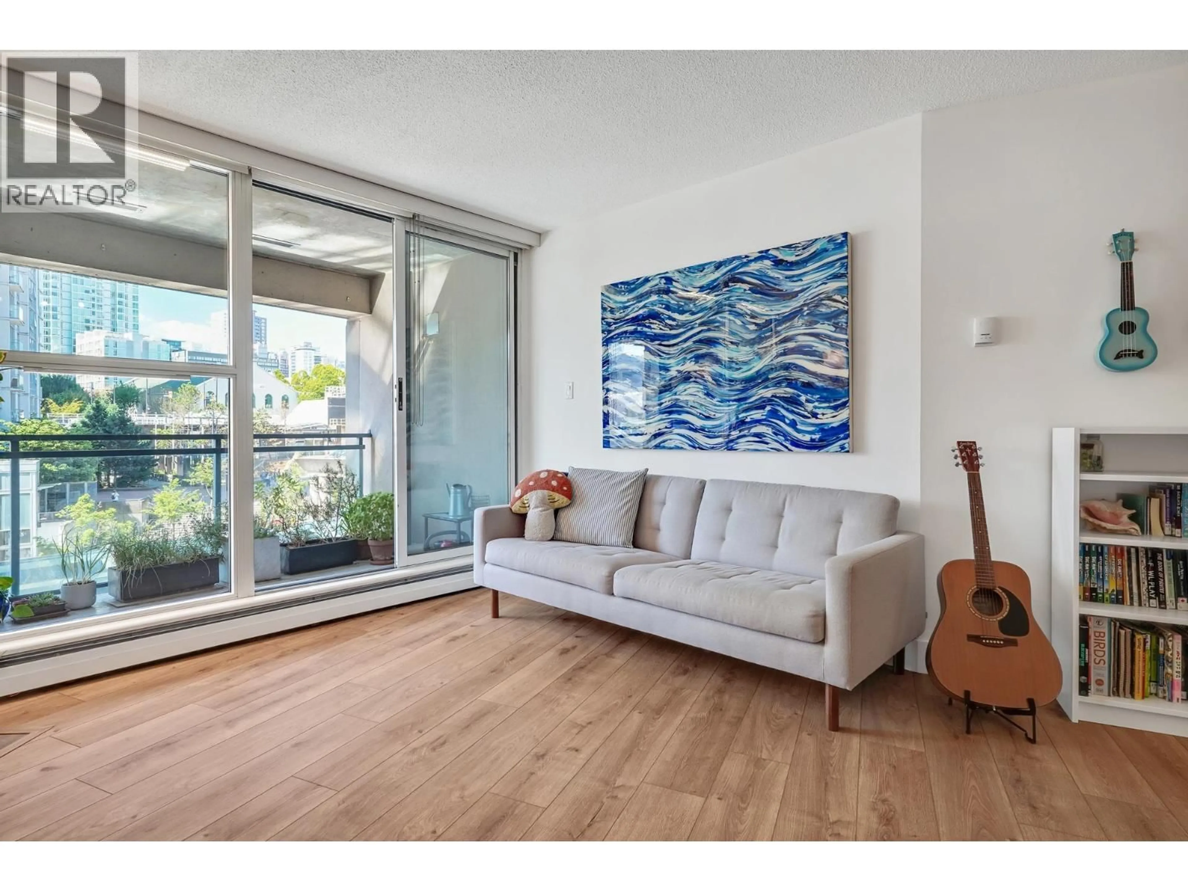 Living room with furniture, wood/laminate floor for 306 - 183 KEEFER PLACE, Vancouver British Columbia V6B6B9