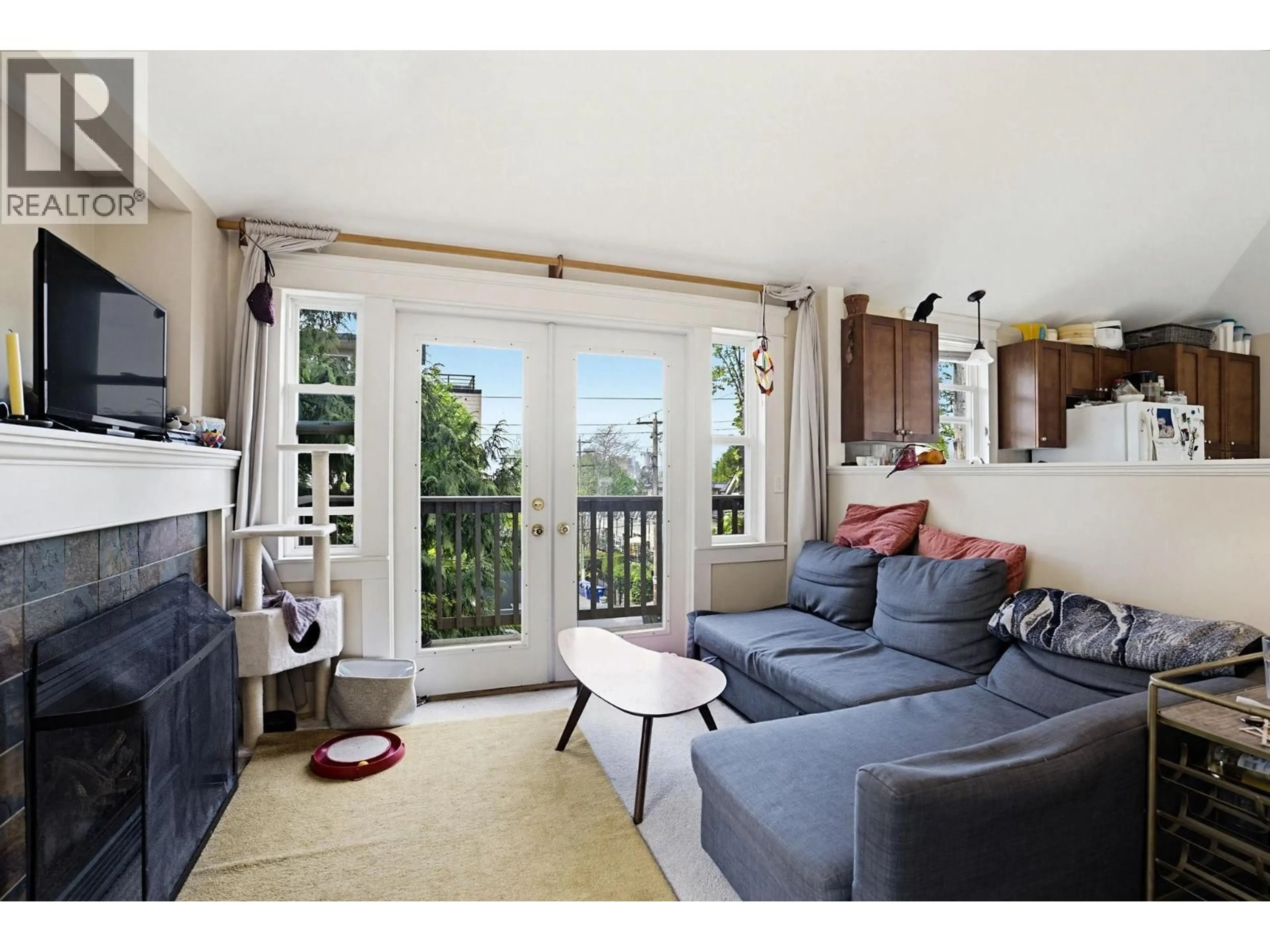 Living room with furniture, wood/laminate floor for 832 SALSBURY DRIVE, Vancouver British Columbia V5L4A2
