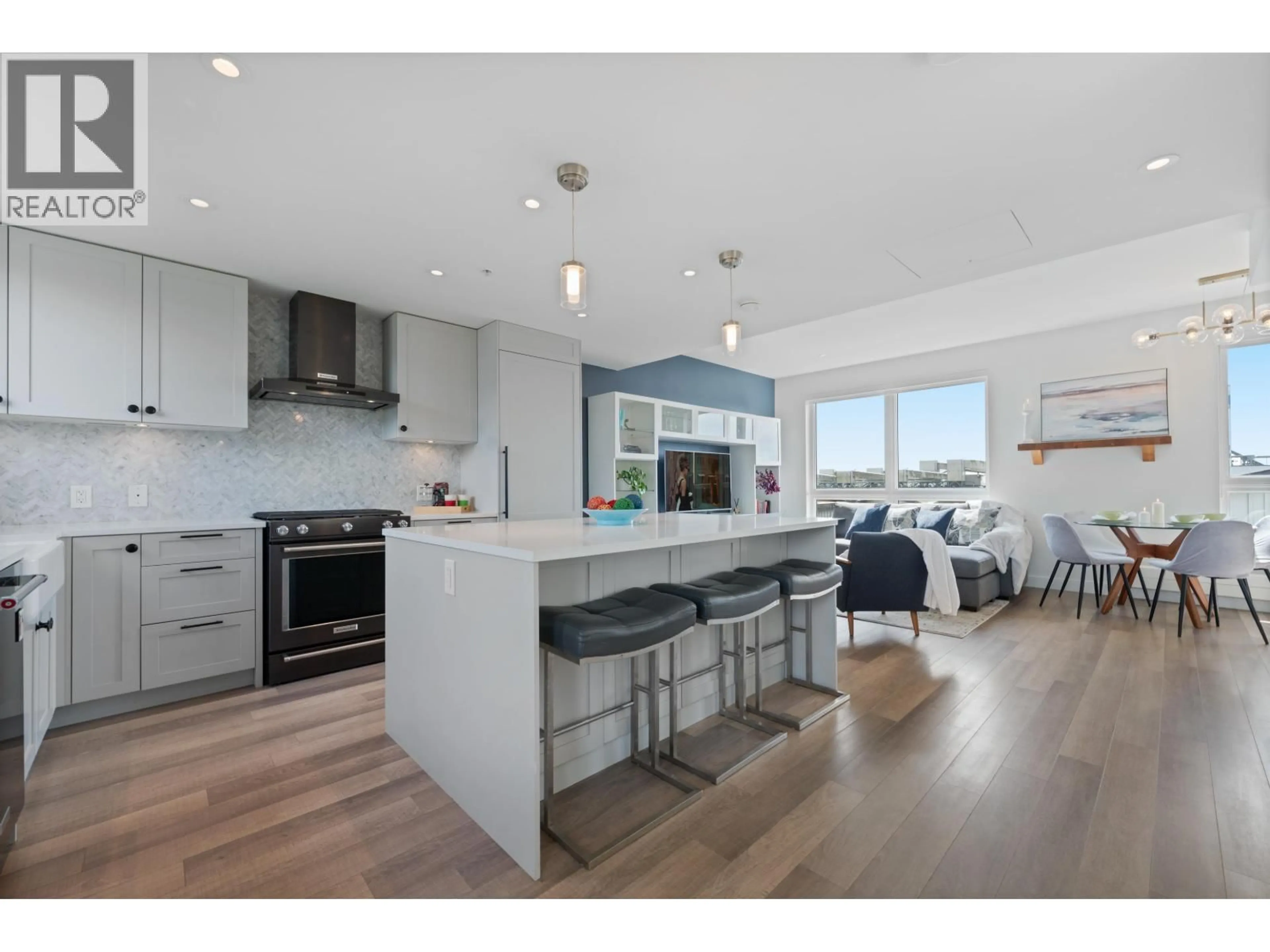 Open concept kitchen, wood/laminate floor for 402 - 505 2ND STREET, North Vancouver British Columbia V7L1E1