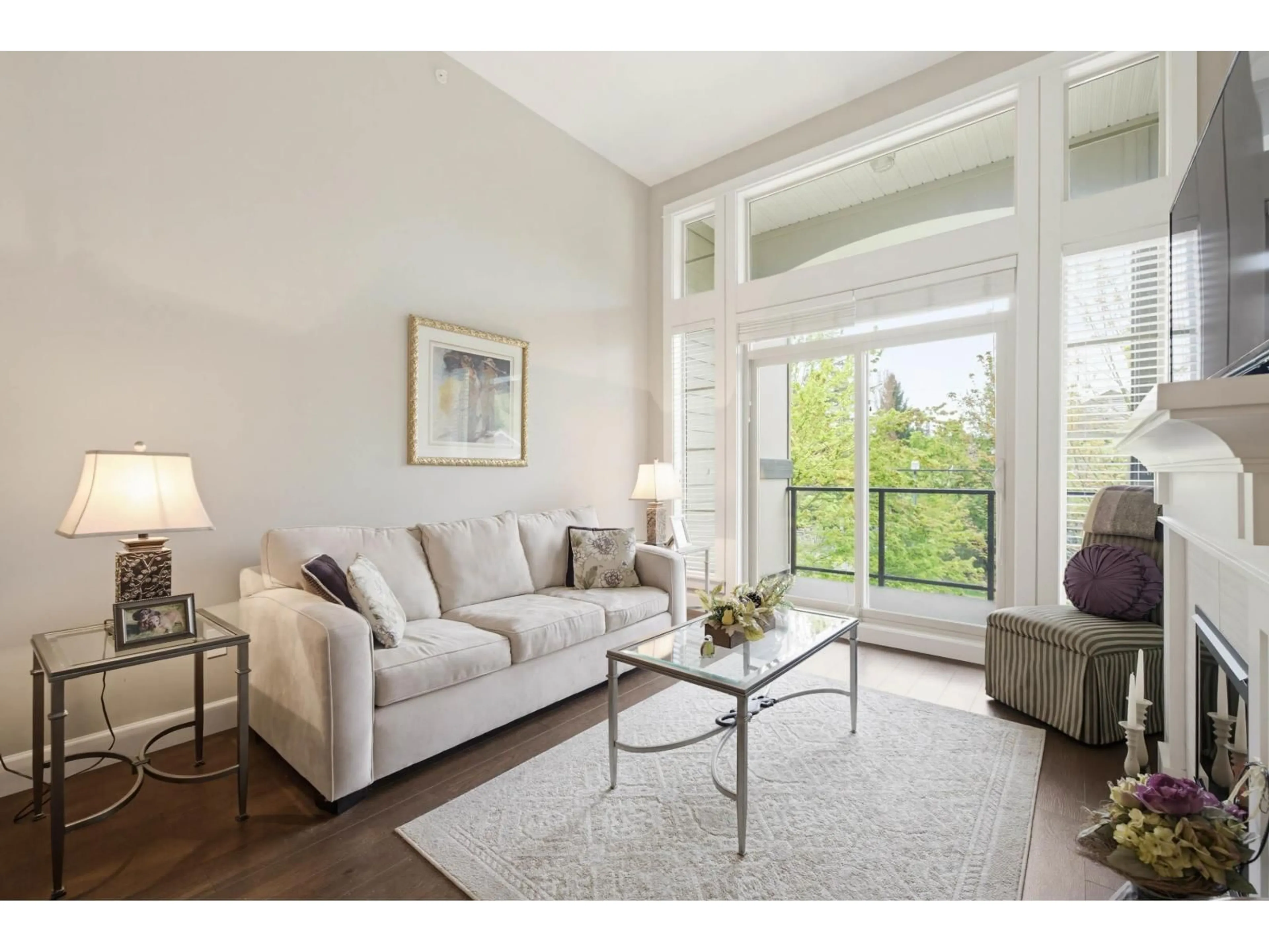 Living room with furniture, wood/laminate floor for 306 - 15195 36 AVENUE, Surrey British Columbia V3Z4R3