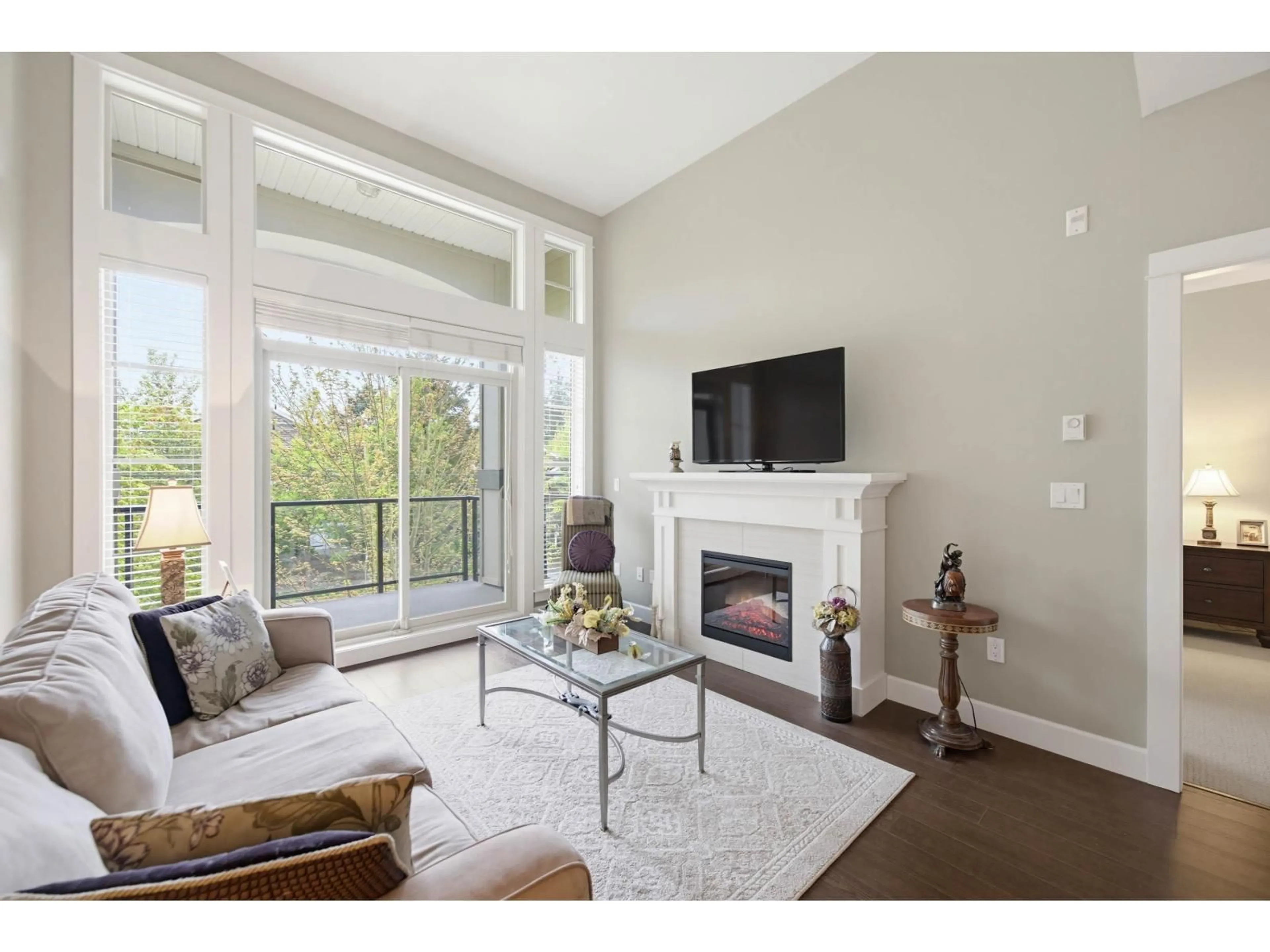 Living room with furniture, wood/laminate floor for 306 - 15195 36 AVENUE, Surrey British Columbia V3Z4R3