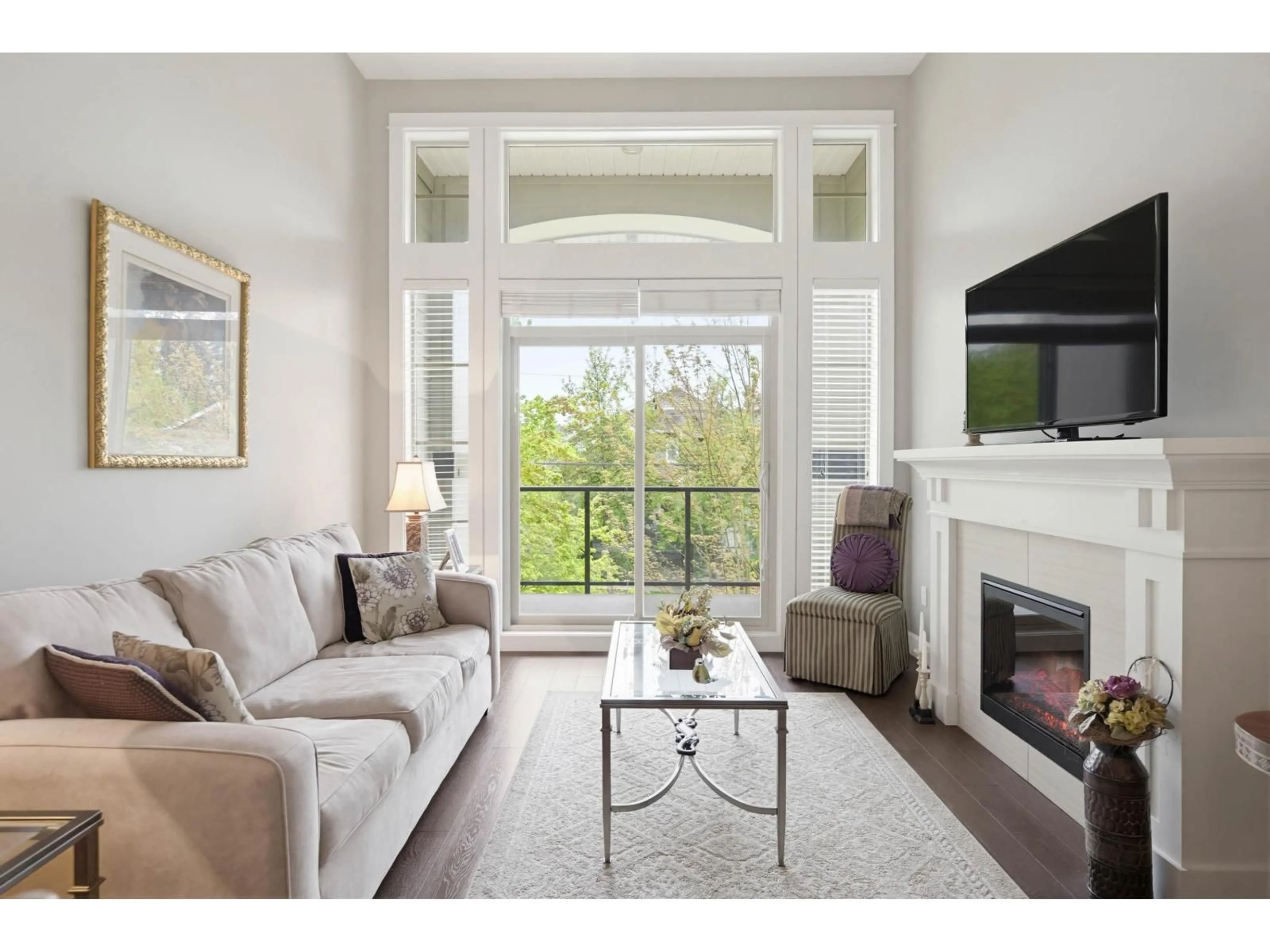 Living room with furniture, wood/laminate floor for 306 - 15195 36 AVENUE, Surrey British Columbia V3Z4R3