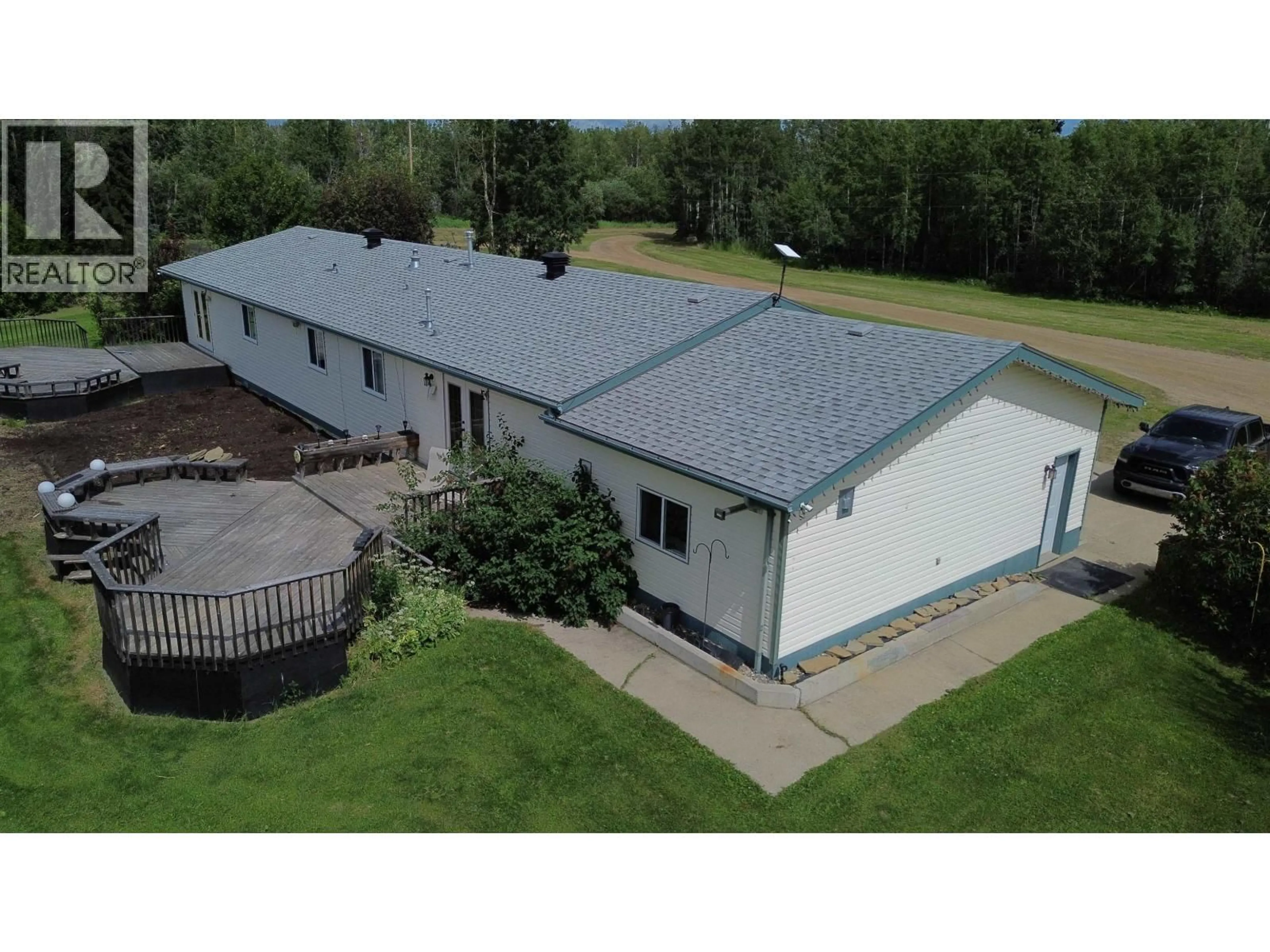 A pic from outside/outdoor area/front of a property/back of a property/a pic from drone, building for 10264 97 HIGHWAY, Charlie Lake British Columbia V1J8L9