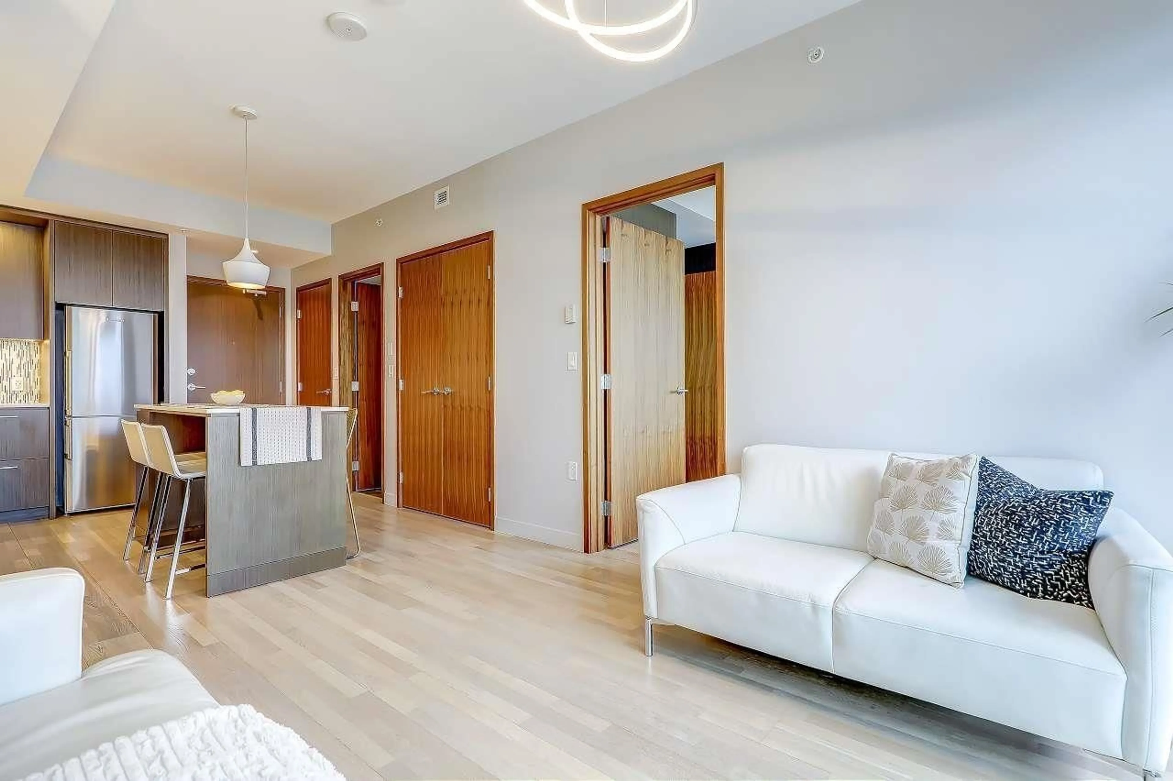 Living room with furniture, wood/laminate floor for 3904 - 13495 CENTRAL AVENUE, Surrey British Columbia V3T0K2