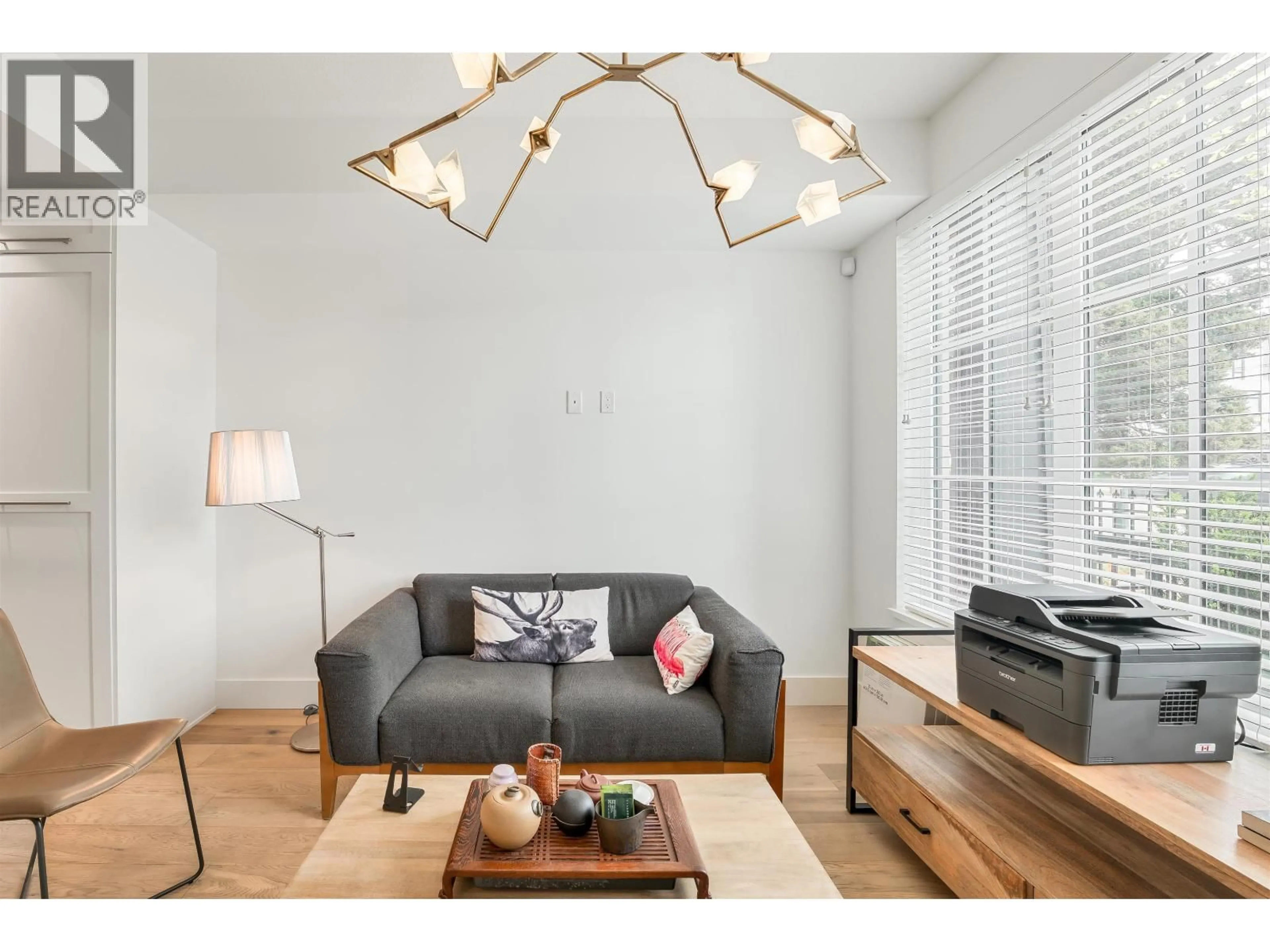 Living room with furniture, wood/laminate floor for 7331 GRANVILLE STREET, Vancouver British Columbia V6P0G5