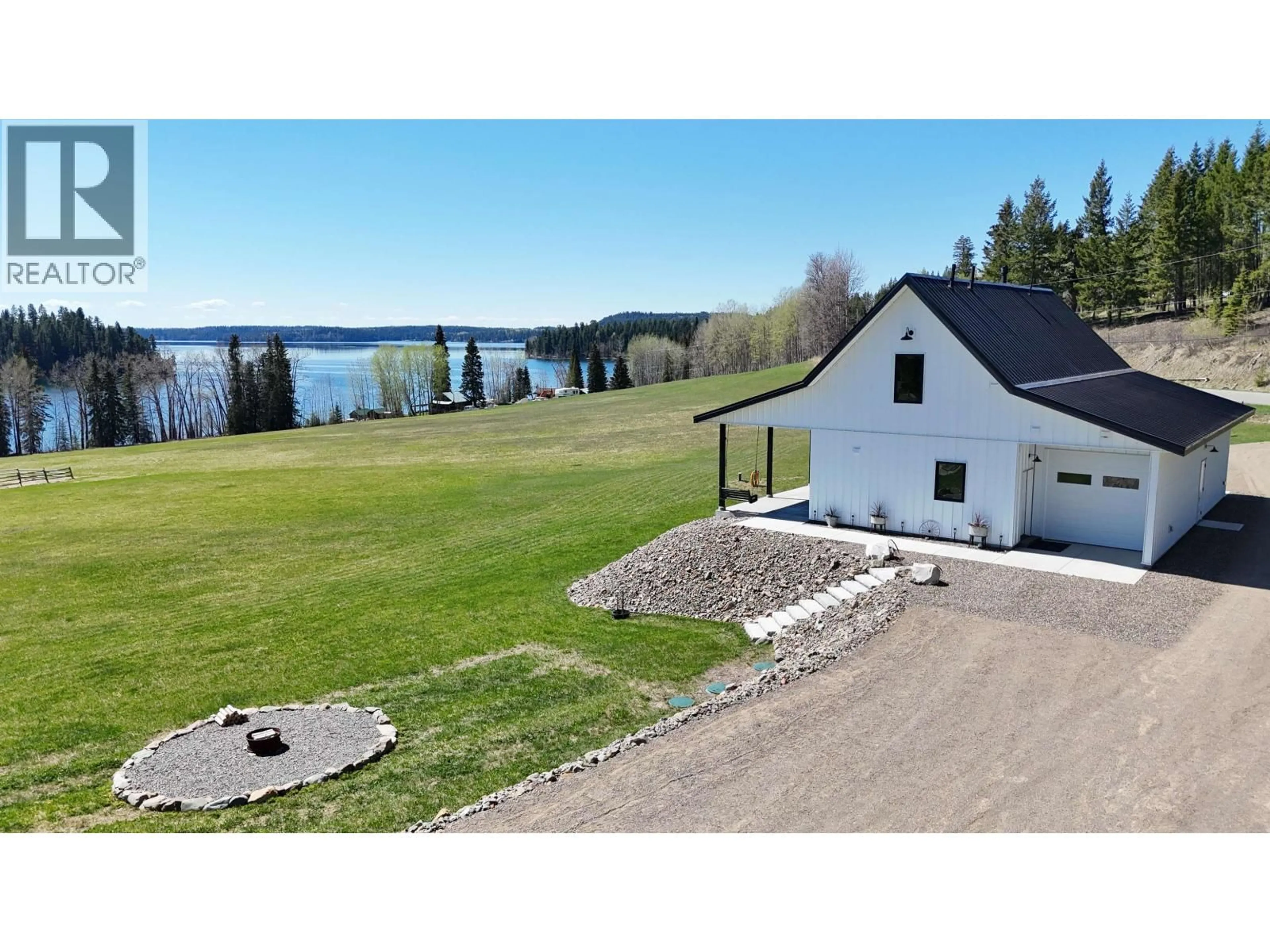 A pic from outside/outdoor area/front of a property/back of a property/a pic from drone, water/lake/river/ocean view for 8116 BRIDGE LAKE ROAD, Bridge Lake British Columbia V0K1X2