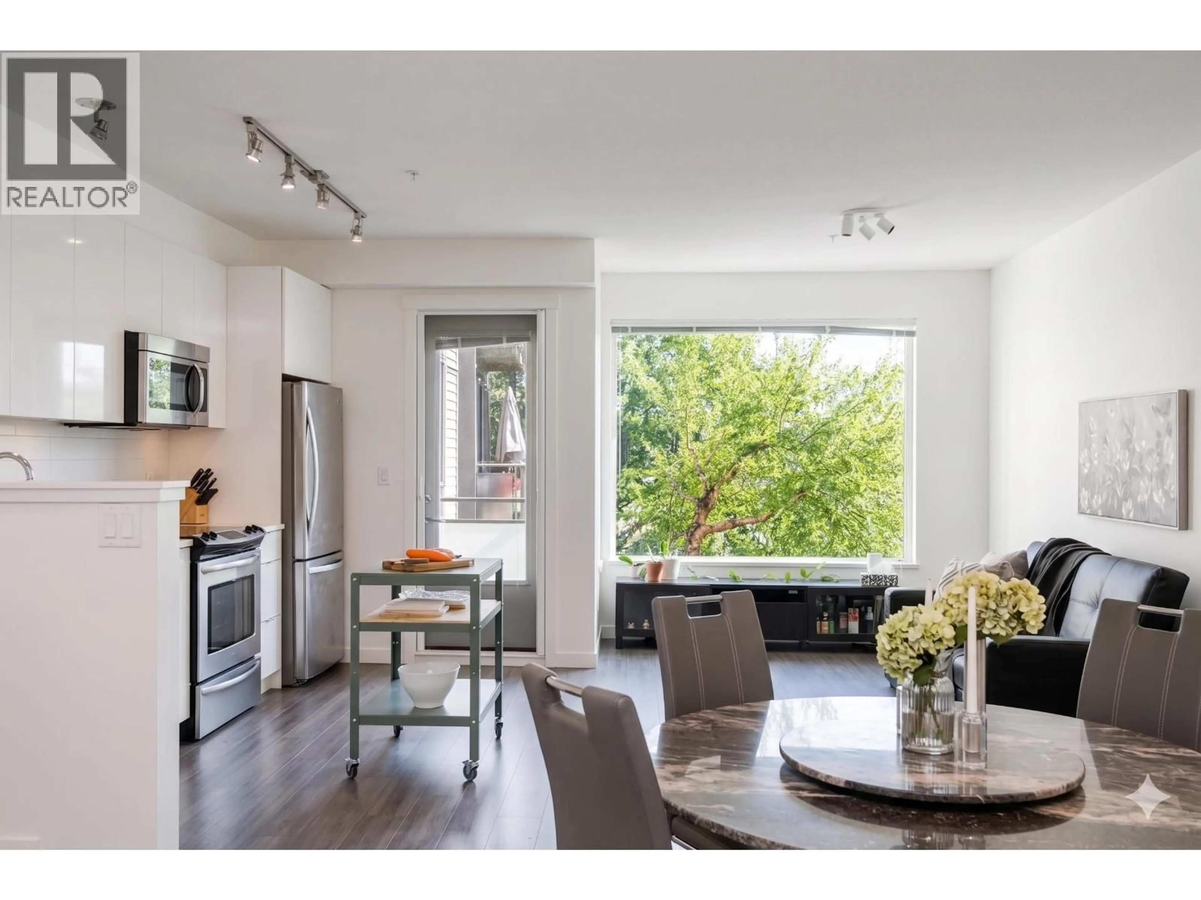 Open concept kitchen, wood/laminate floor for 301 - 3138 RIVERWALK AVENUE, Vancouver British Columbia V5S0B6