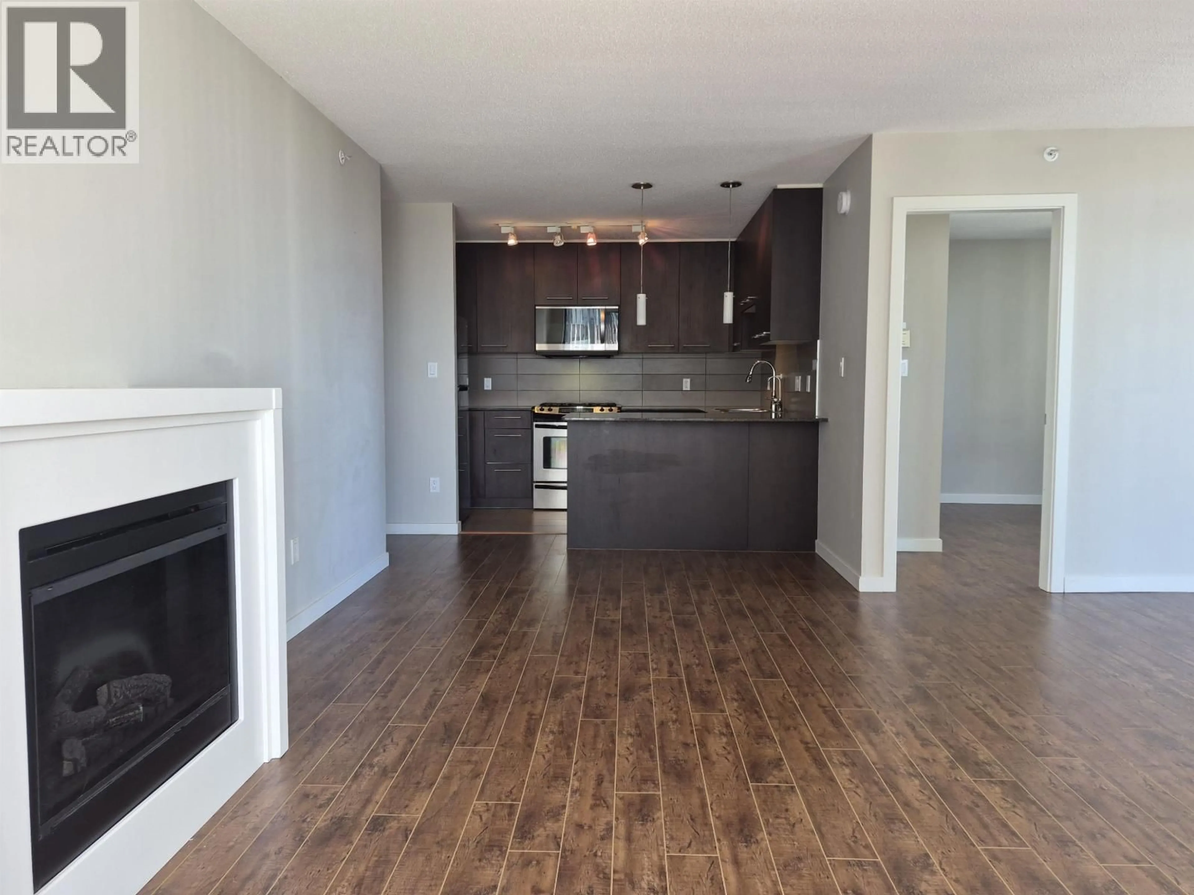 Open concept kitchen, wood/laminate floor for 1703 - 2979 GLEN DRIVE, Coquitlam British Columbia V3B0B2
