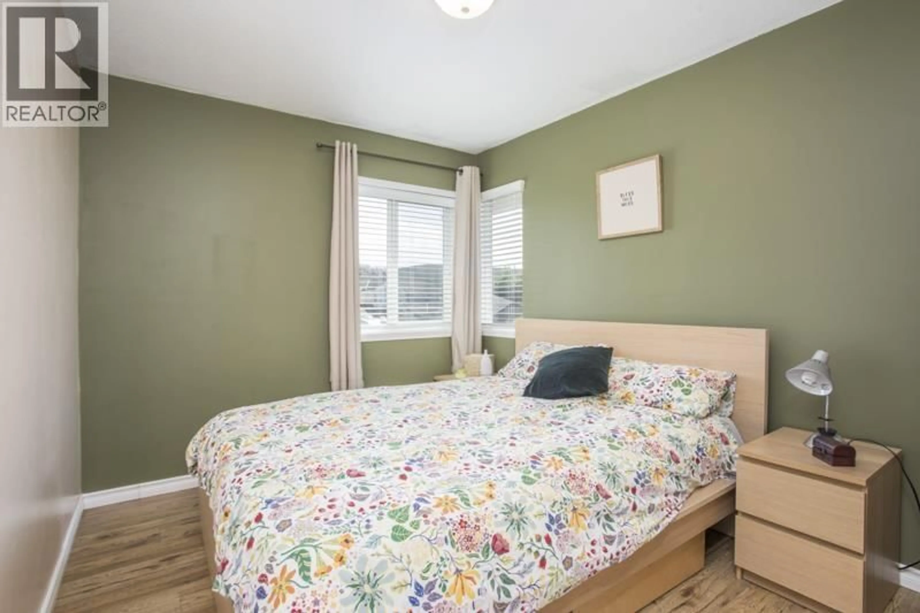 Bedroom with bed, wood/laminate floor for 12181 CHESTNUT CRESCENT, Pitt Meadows British Columbia V3Y2C8