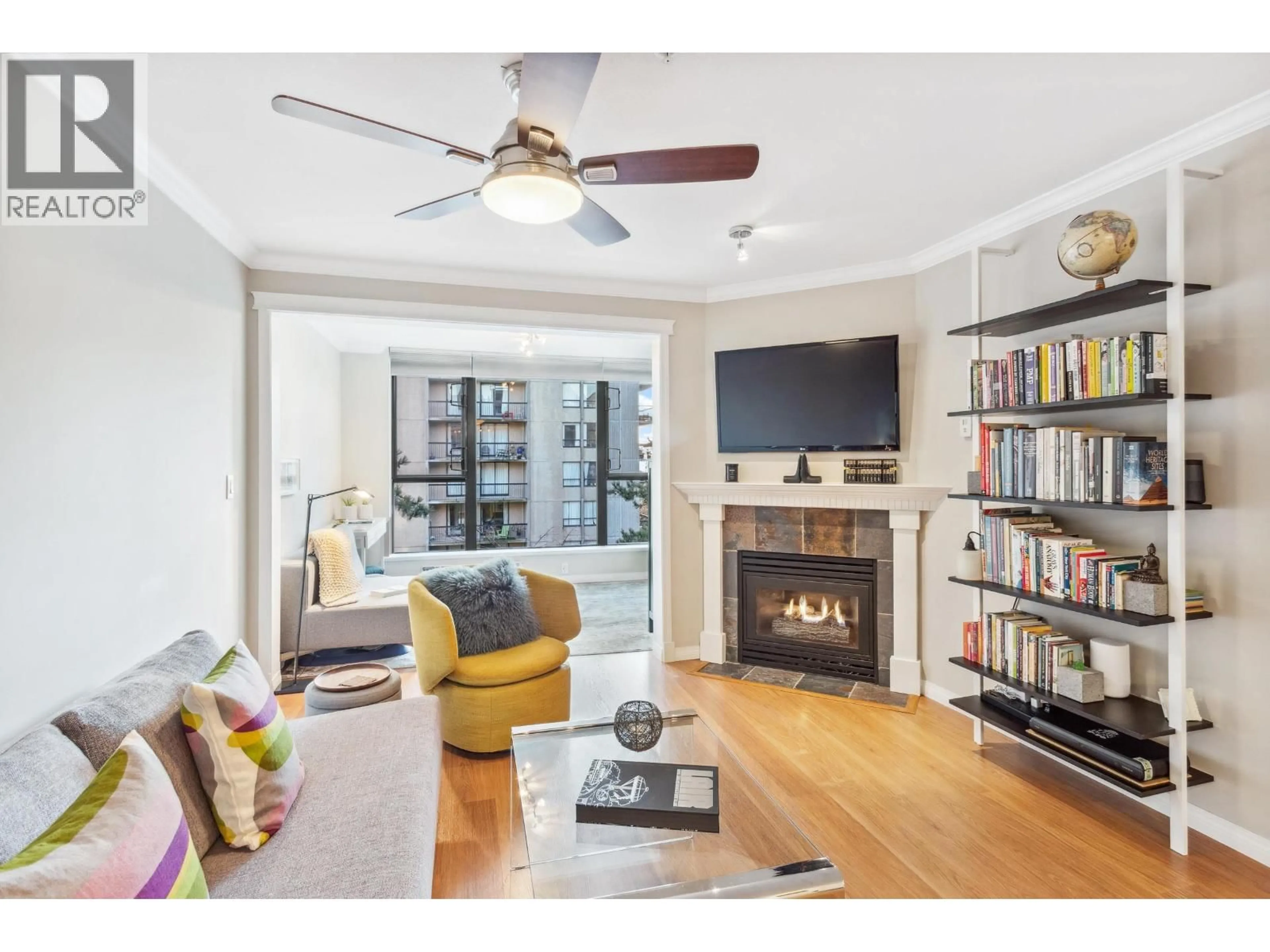 Living room with furniture, wood/laminate floor for 206 - 175 10TH STREET, North Vancouver British Columbia V7L4W1