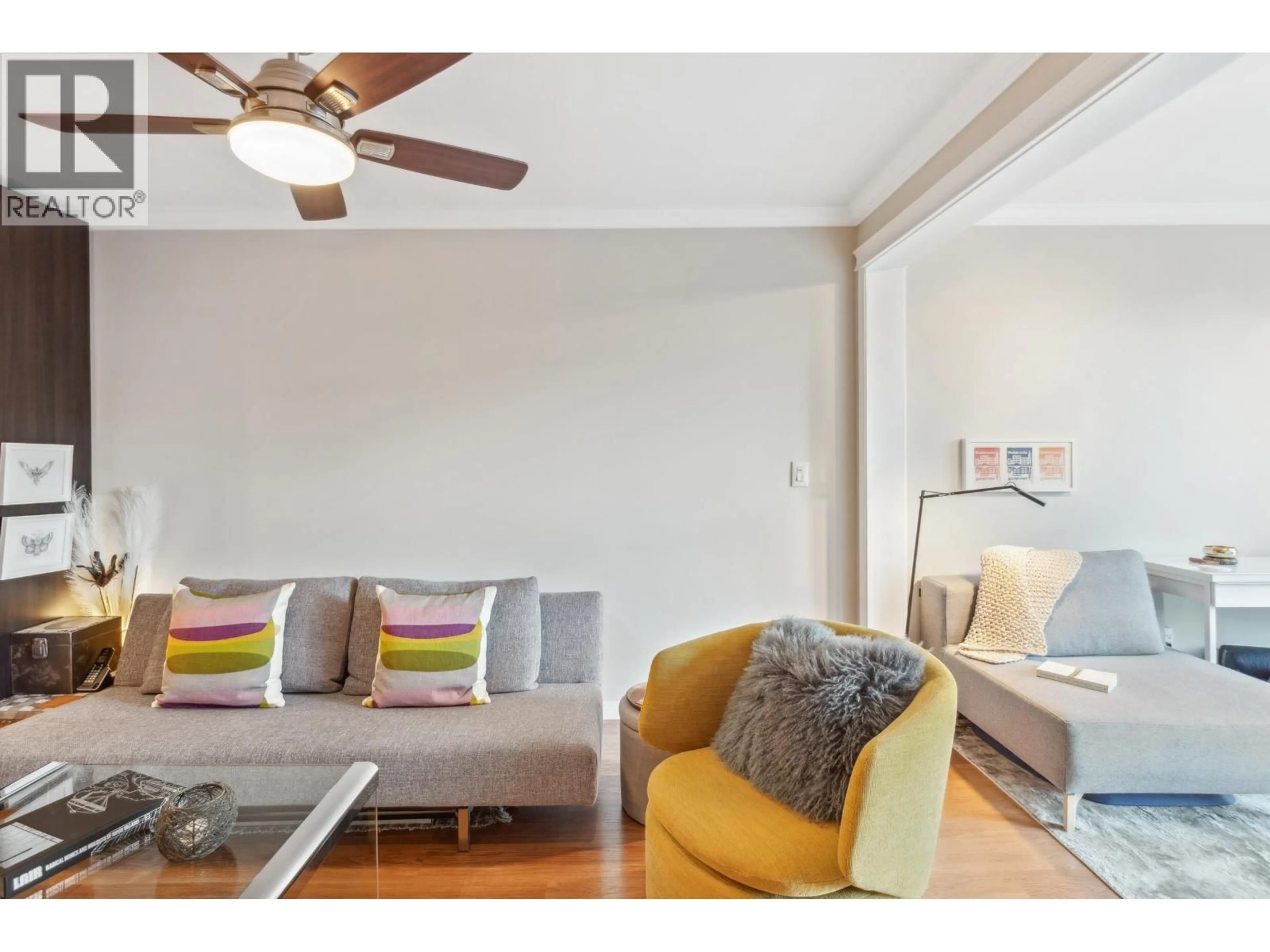 Living room with furniture, wood/laminate floor for 206 - 175 10TH STREET, North Vancouver British Columbia V7L4W1