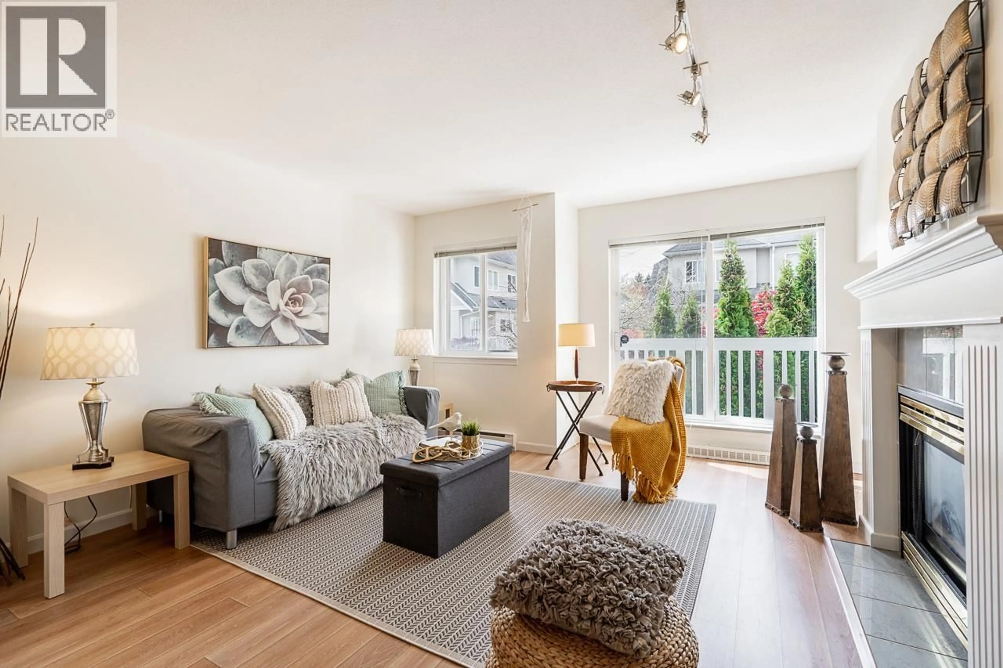 Living room with furniture, wood/laminate floor for 35 - 7831 GARDEN CITY ROAD, Richmond British Columbia V6Y4A3