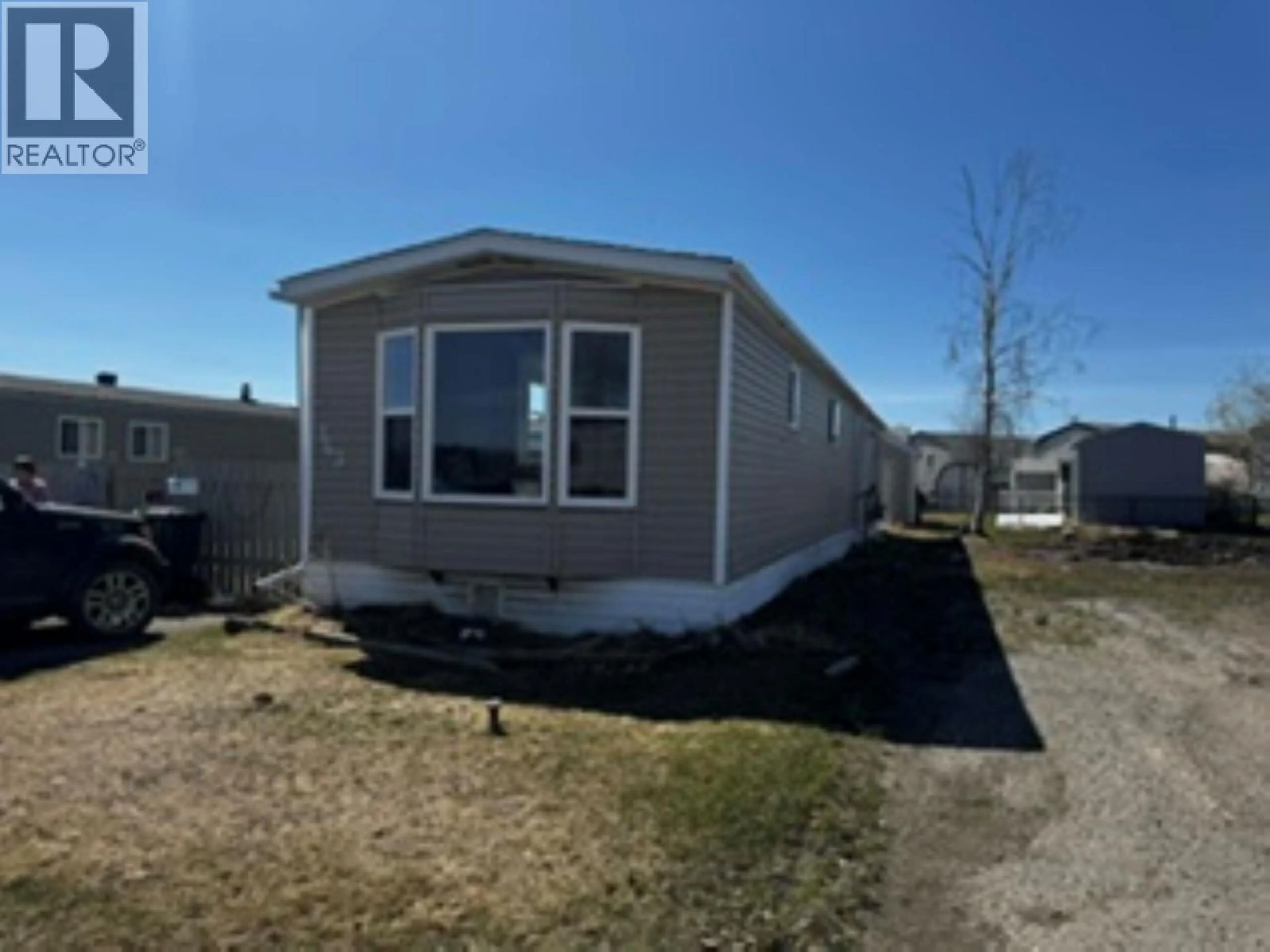 Home with vinyl exterior material, street for 143 - 9207 82 STREET, Fort St. John British Columbia V1J5G5