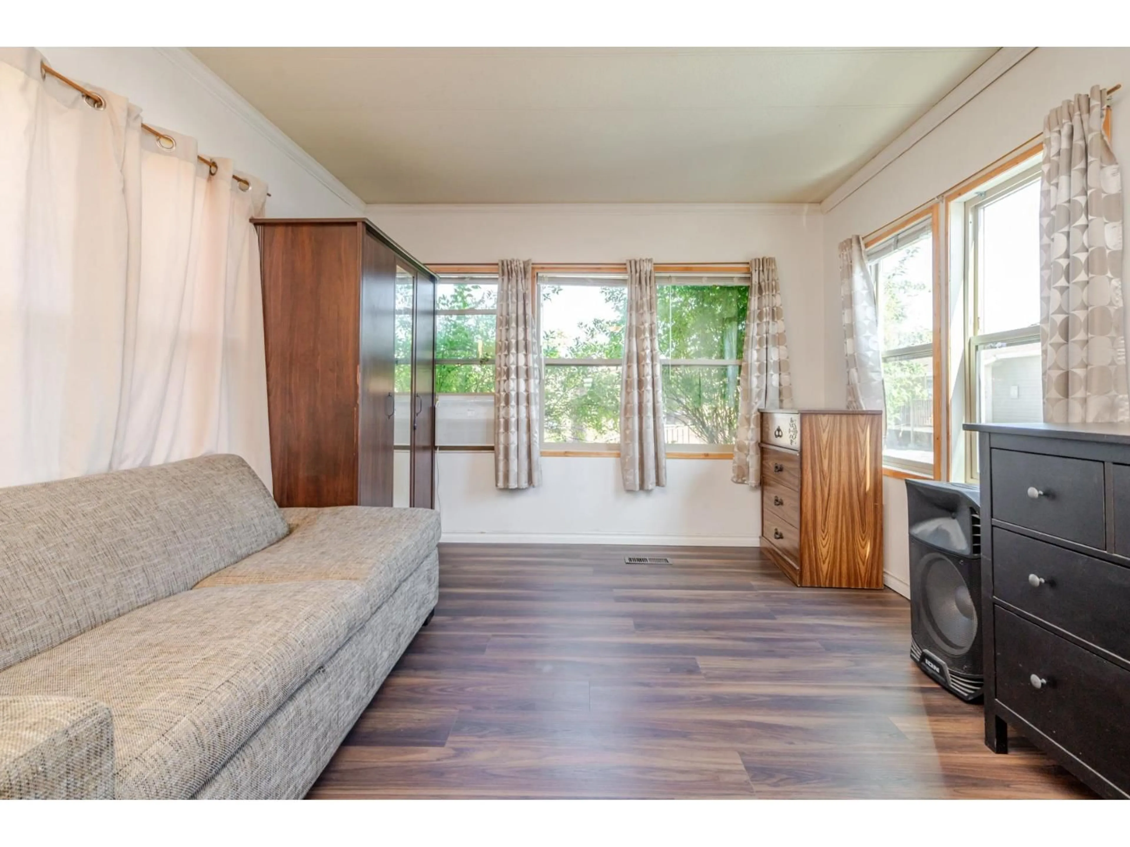 Living room with furniture, wood/laminate floor for 20 - 26892 FRASER HIGHWAY, Langley British Columbia V4W3T5