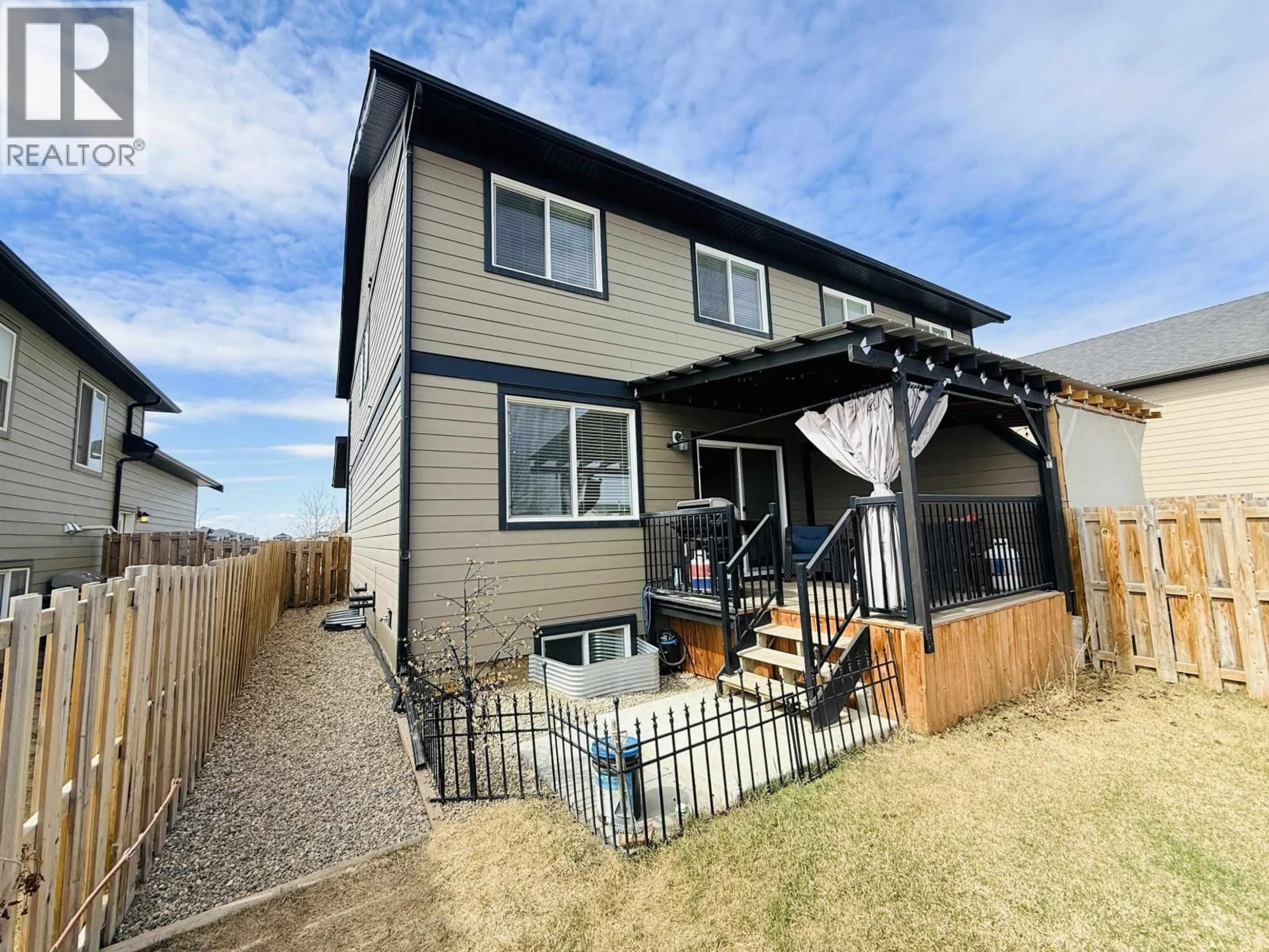 Home with vinyl exterior material, street for 8803 82 STREET, Fort St. John British Columbia V1J0N9