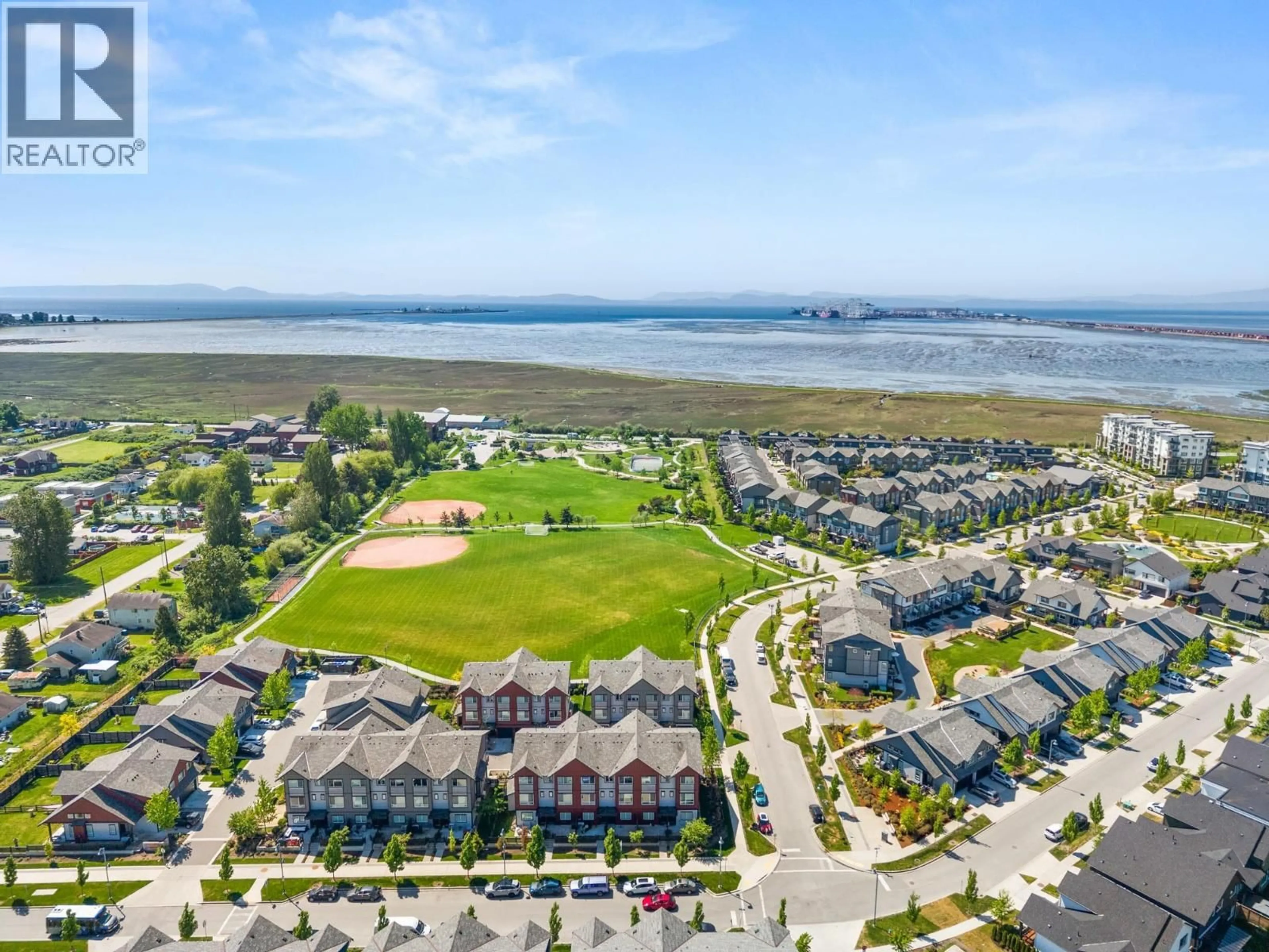 A pic from outside/outdoor area/front of a property/back of a property/a pic from drone, water/lake/river/ocean view for 20 - 4408 CORMORANT WAY, Tsawwassen British Columbia V4M0E9
