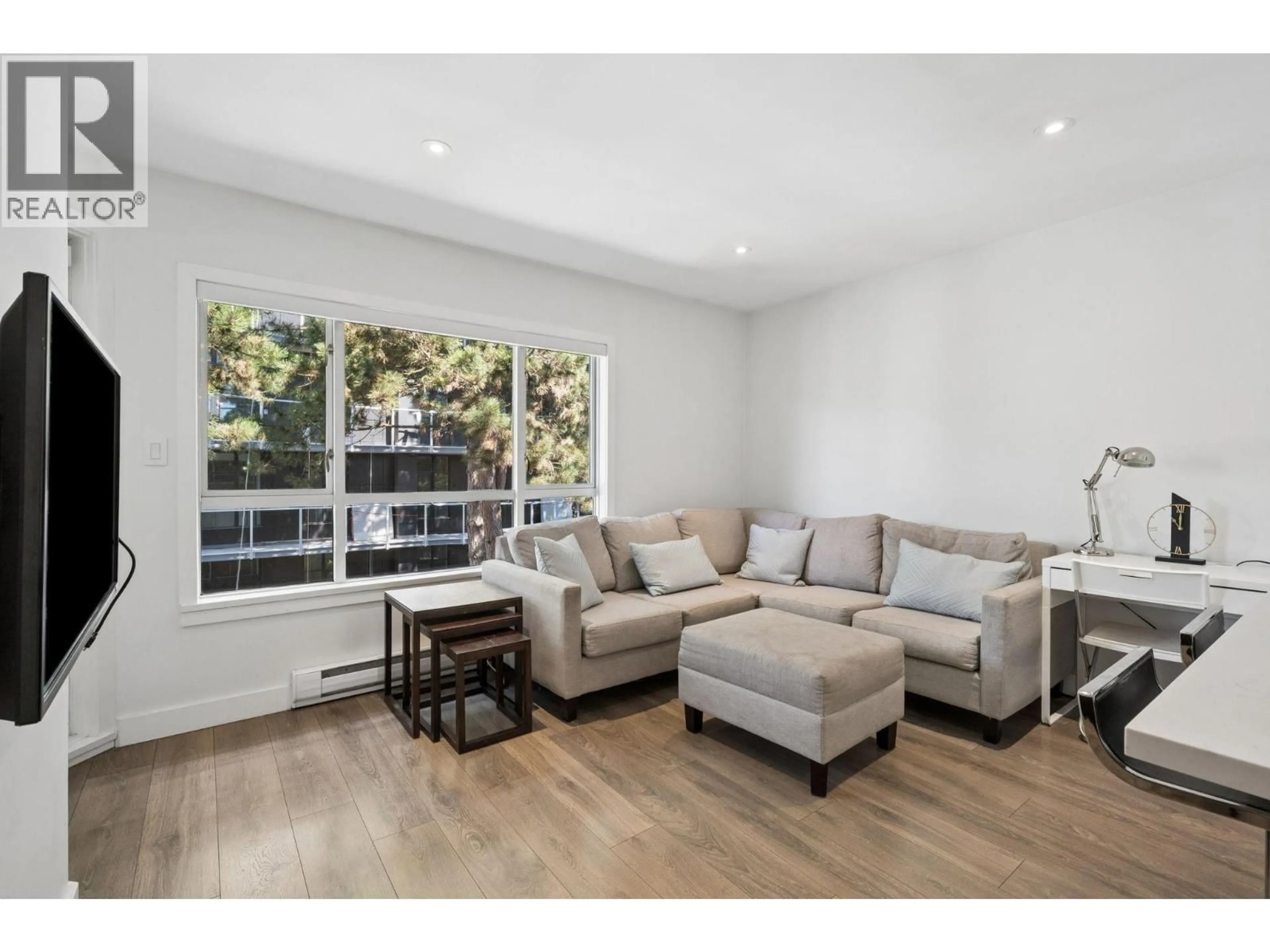 Living room with furniture, wood/laminate floor for 302 - 555 14TH AVENUE, Vancouver British Columbia V5Z4G8