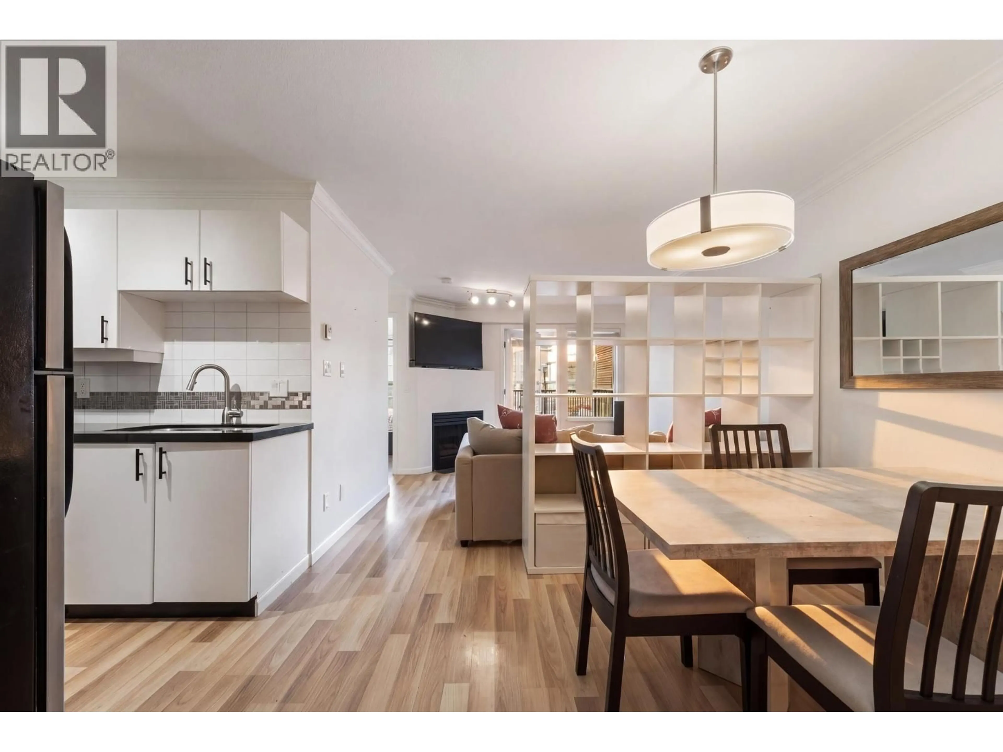 Open concept kitchen, wood/laminate floor for 311 - 2680 4TH AVENUE, Vancouver British Columbia V6K4S3