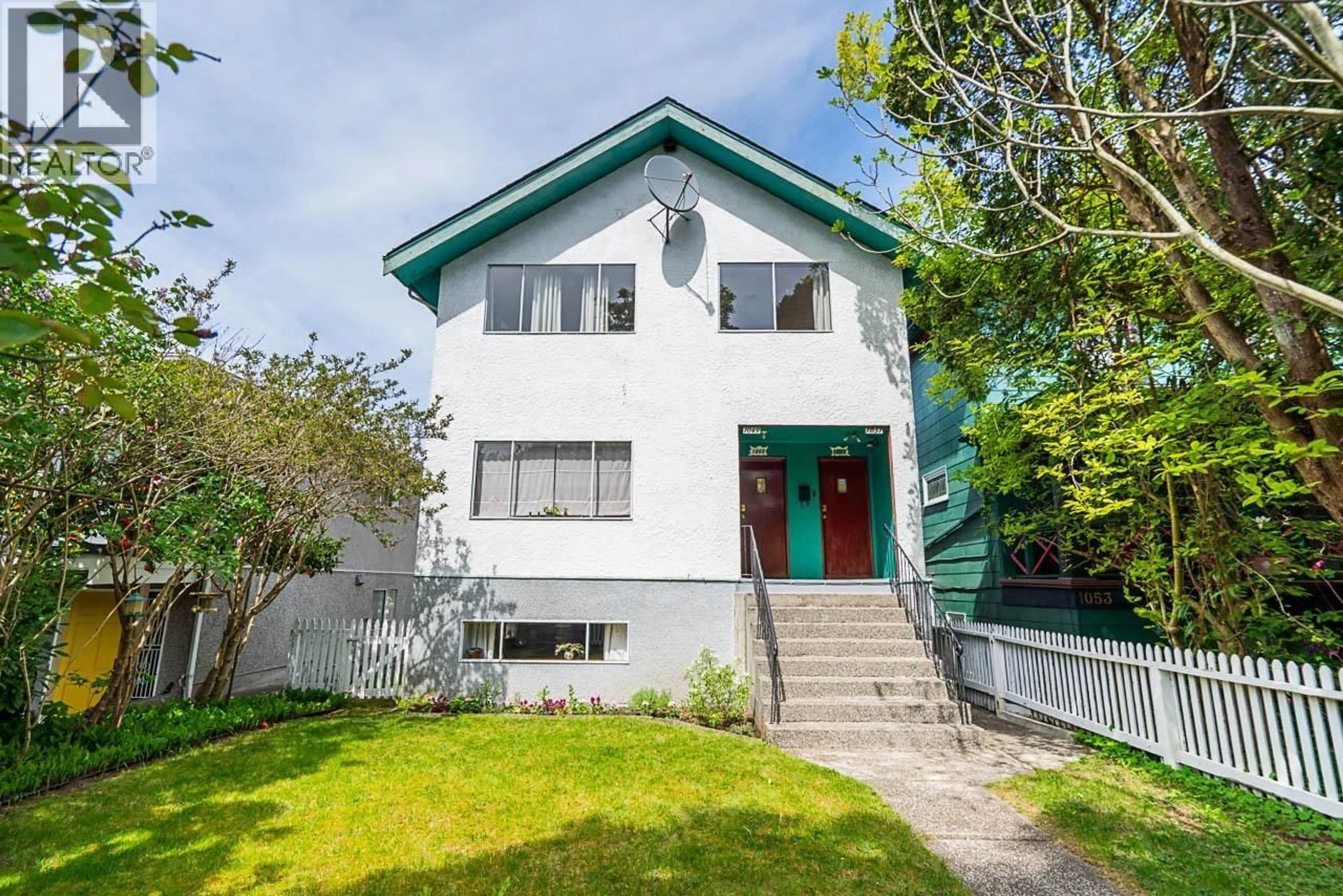 Home with vinyl exterior material, street for 1049 11TH AVENUE, Vancouver British Columbia V5T2G1