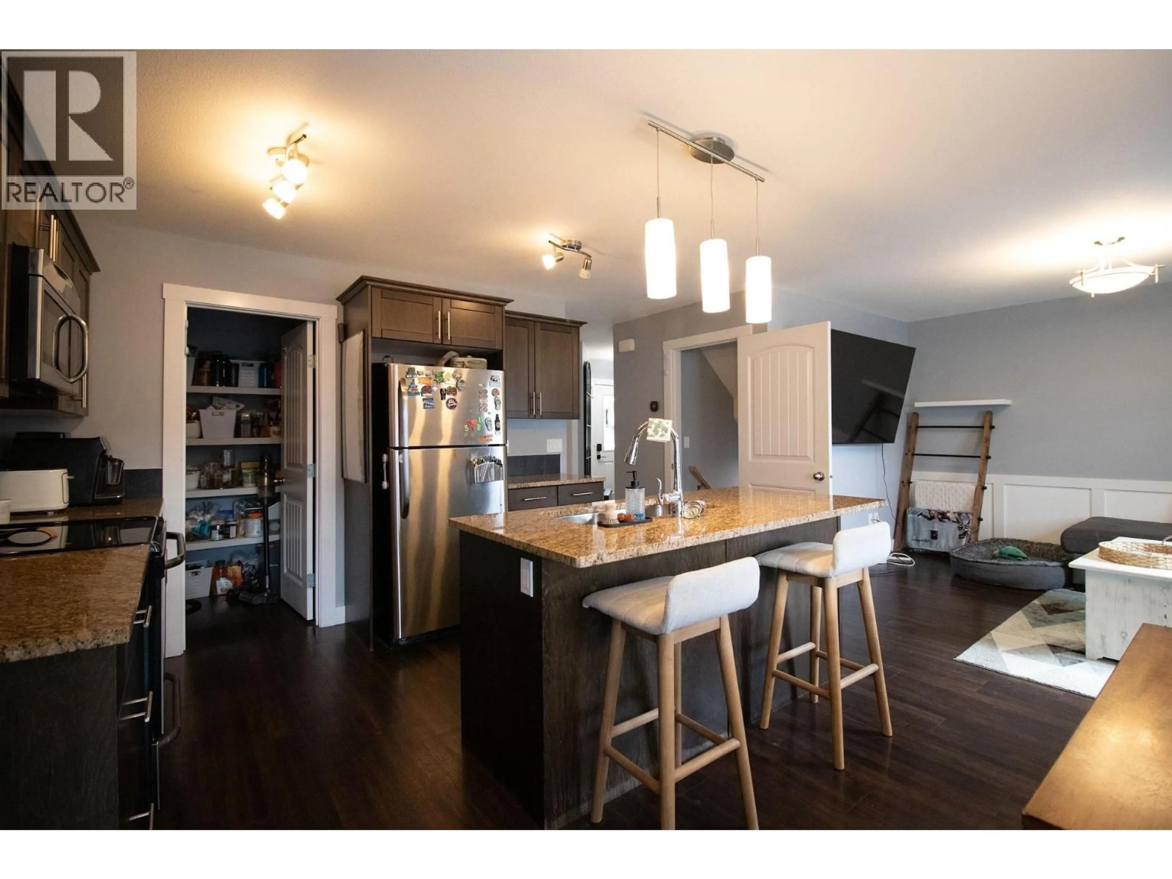 Open concept kitchen, wood/laminate floor for 146 - 10104 114A AVENUE, Fort St. John British Columbia V1J0K5