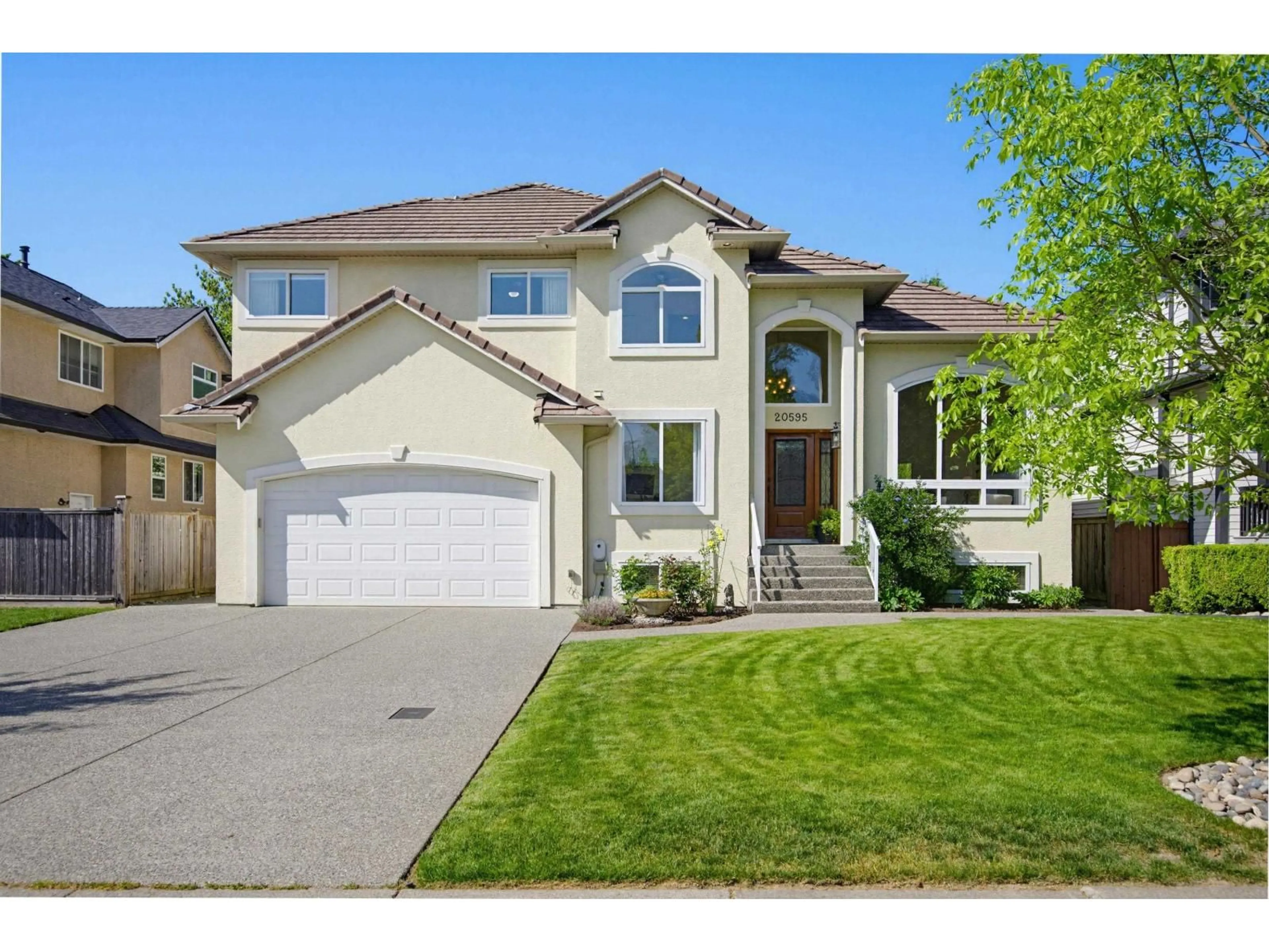 Home with vinyl exterior material, street for 20595 97B AVENUE, Langley British Columbia V1M2H5