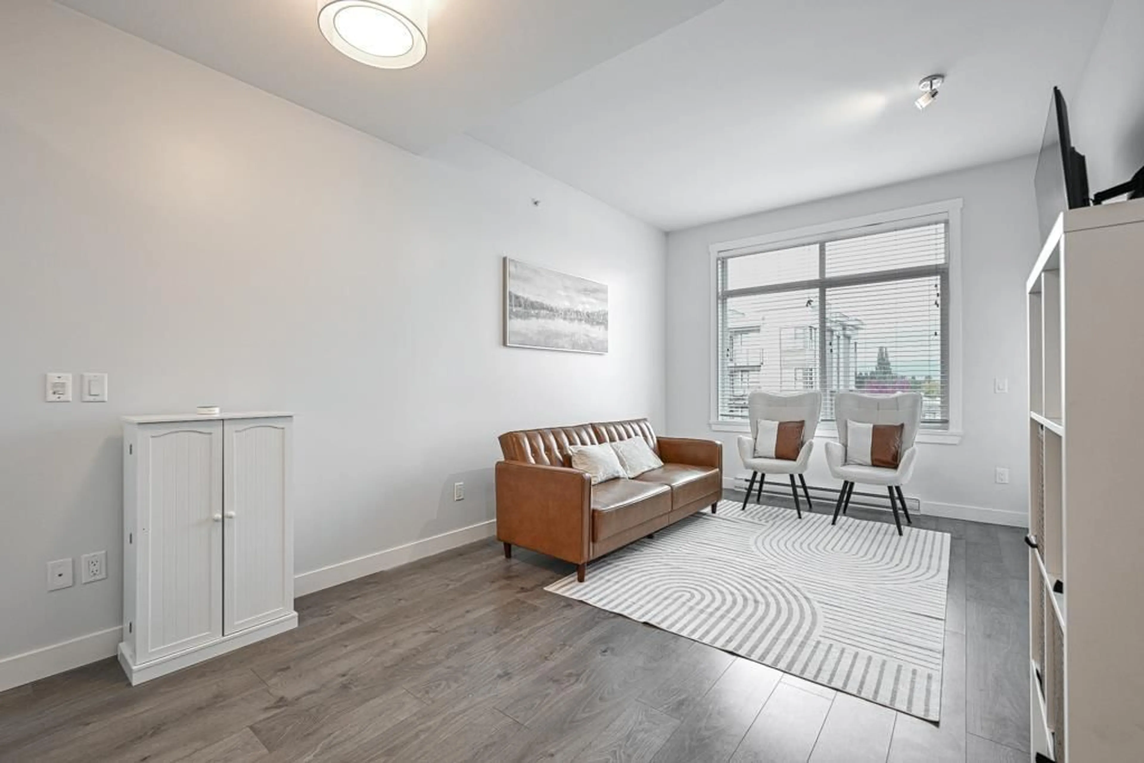 Living room with furniture, wood/laminate floor for 503 - 20696 EASTLEIGH CRESCENT, Langley British Columbia V3A0M3