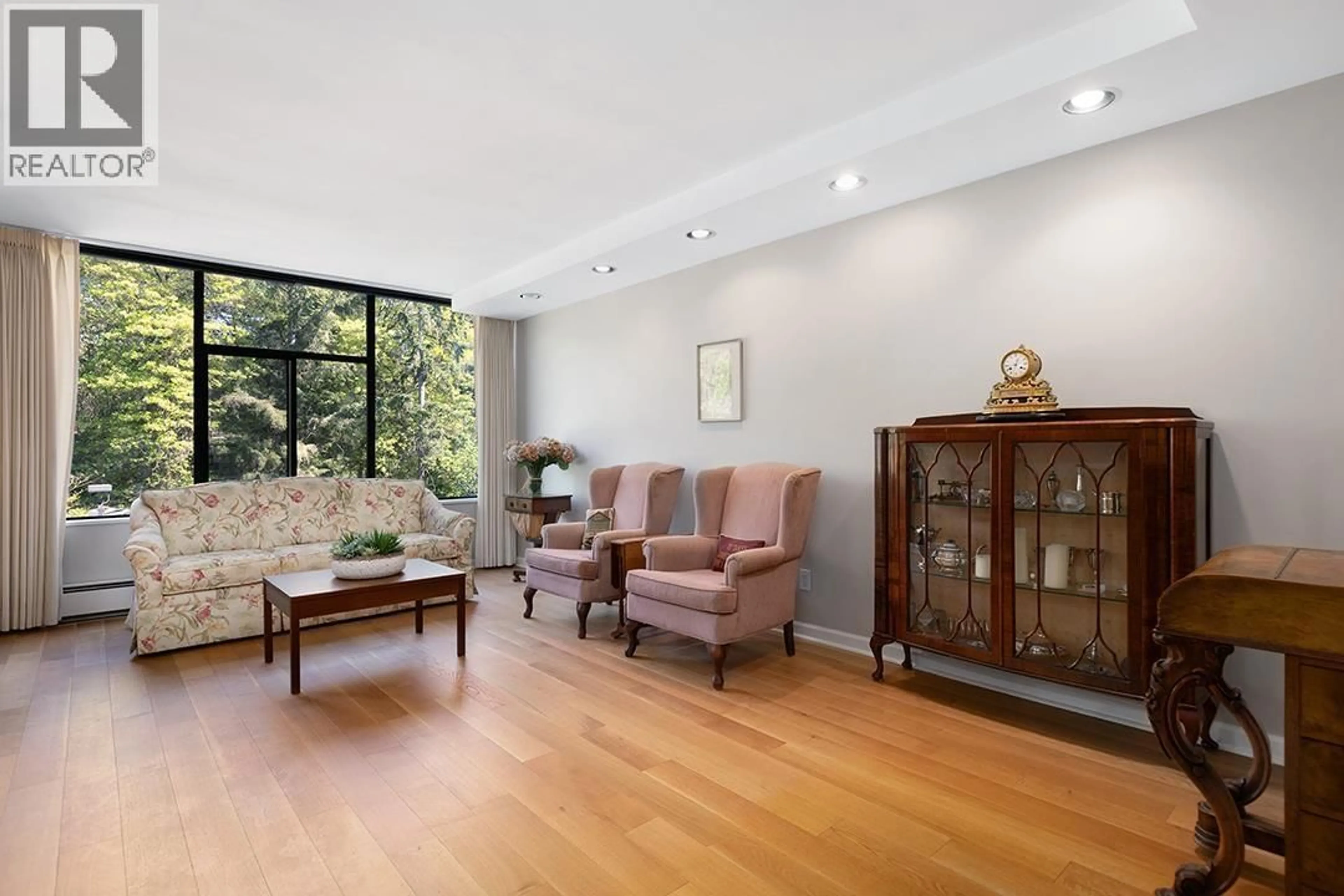 Living room with furniture, wood/laminate floor for 309 - 4101 YEW STREET, Vancouver British Columbia V6L3B7
