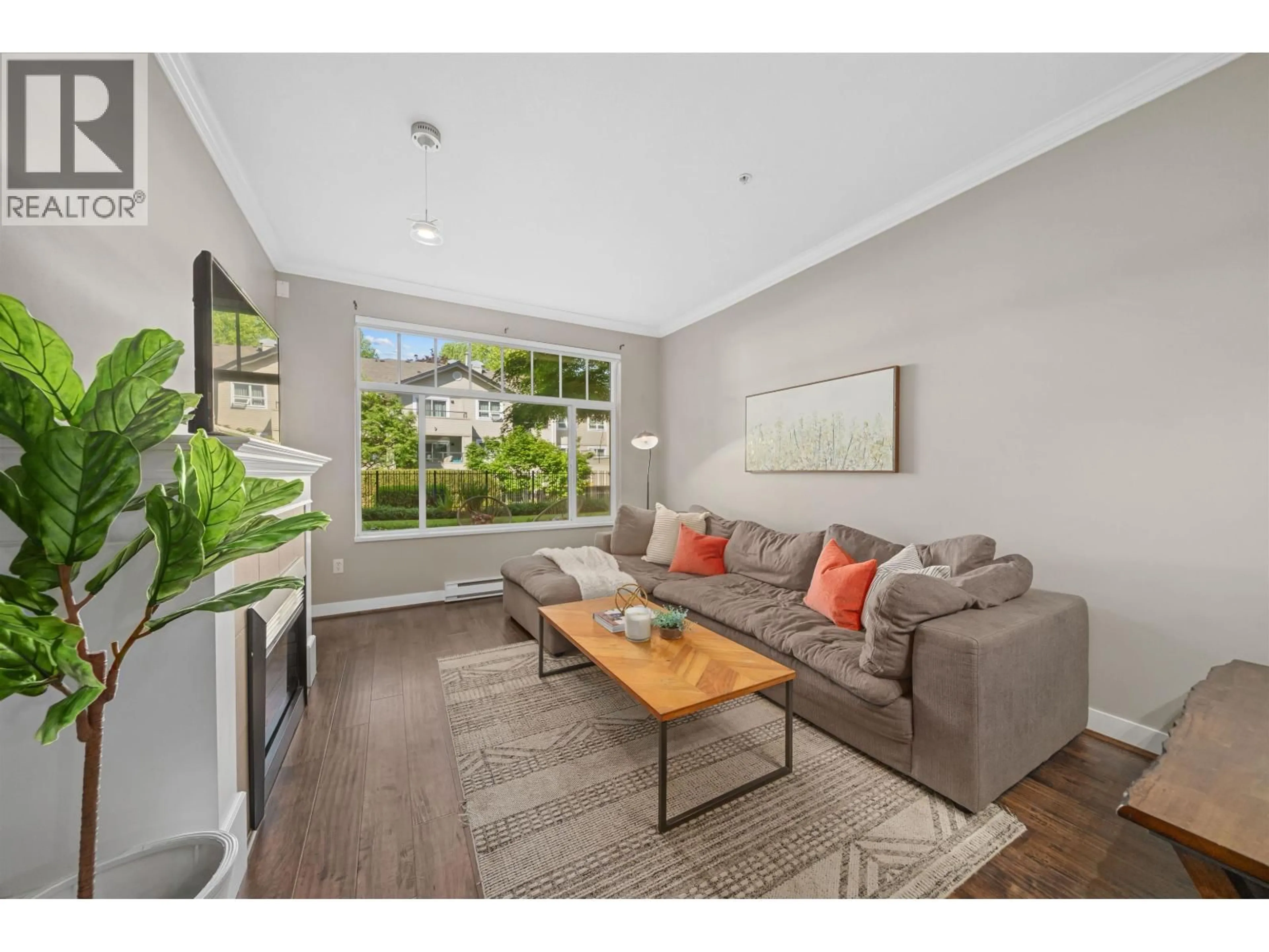 Living room with furniture, wood/laminate floor for 116 - 2353 MARPOLE AVENUE, Port Coquitlam British Columbia V3S2A1
